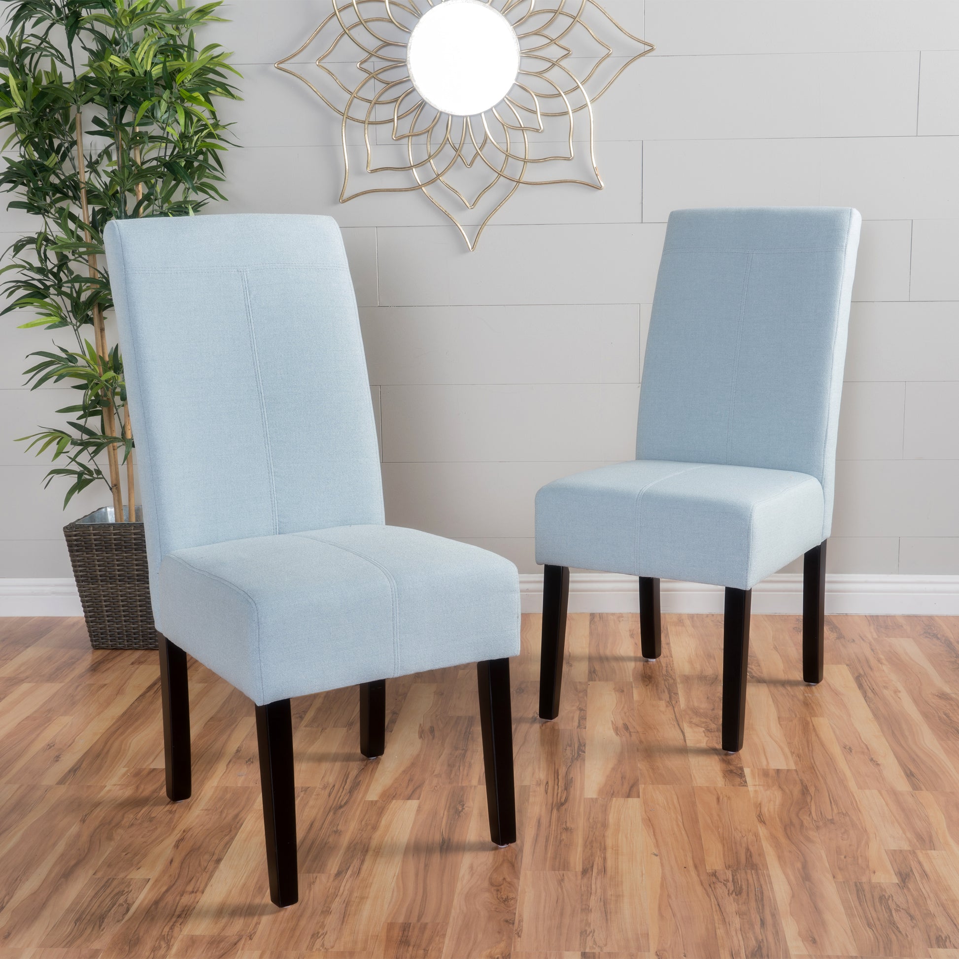 Light blue fabric dining chairs with dark wooden legs set of