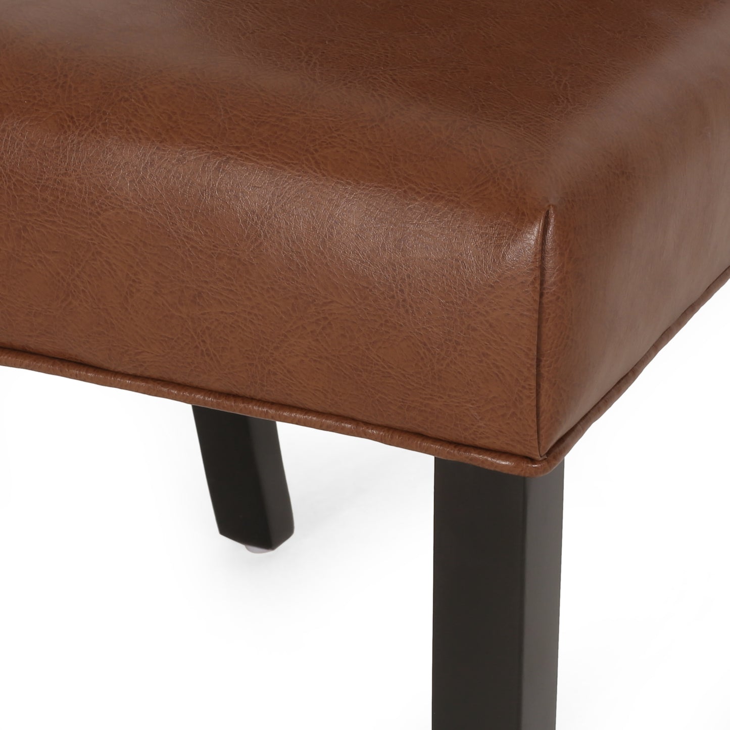 Brown faux leather armchair cushion with stitched seams and a black metal leg
