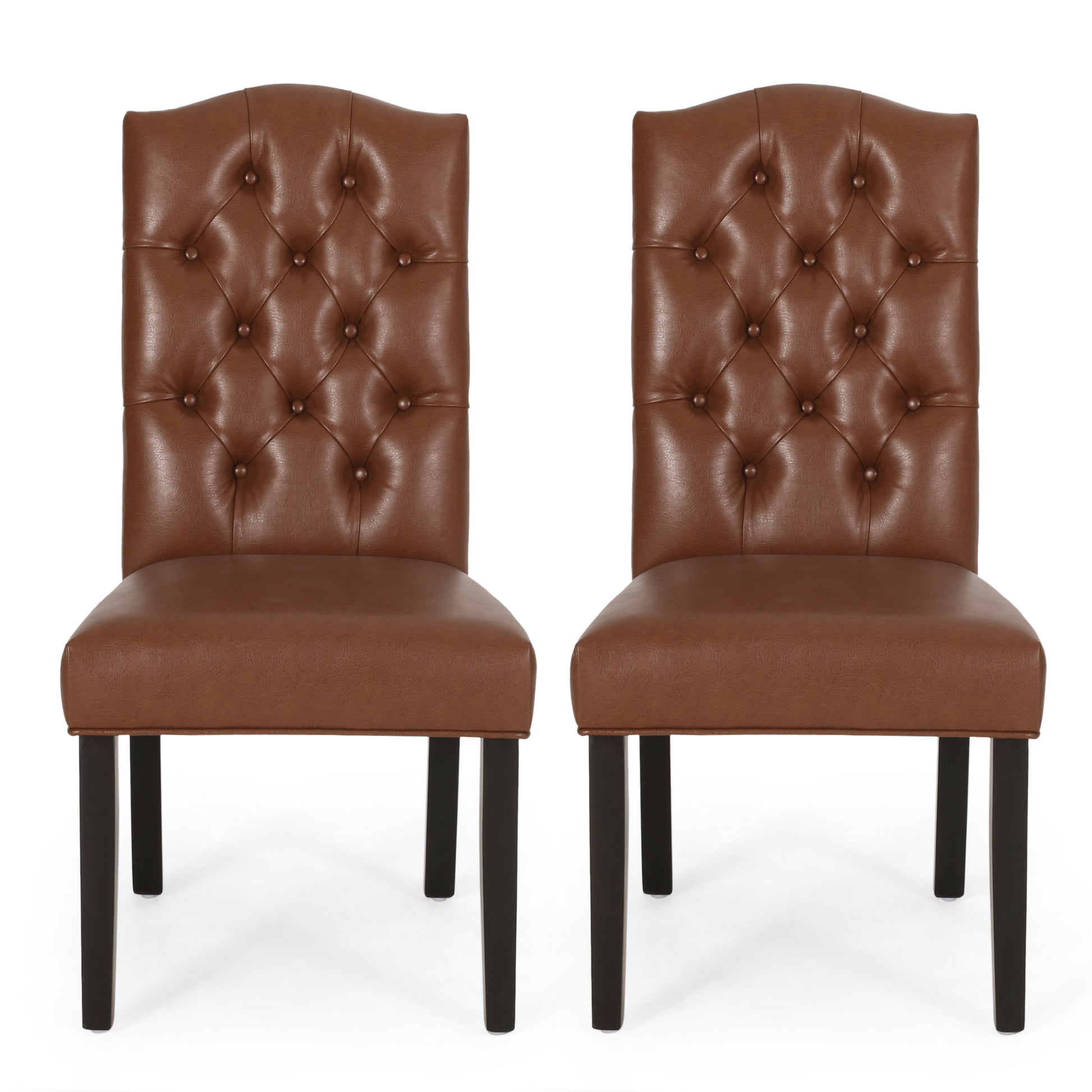 Two brown faux leather tufted dining chairs with dark wood legs