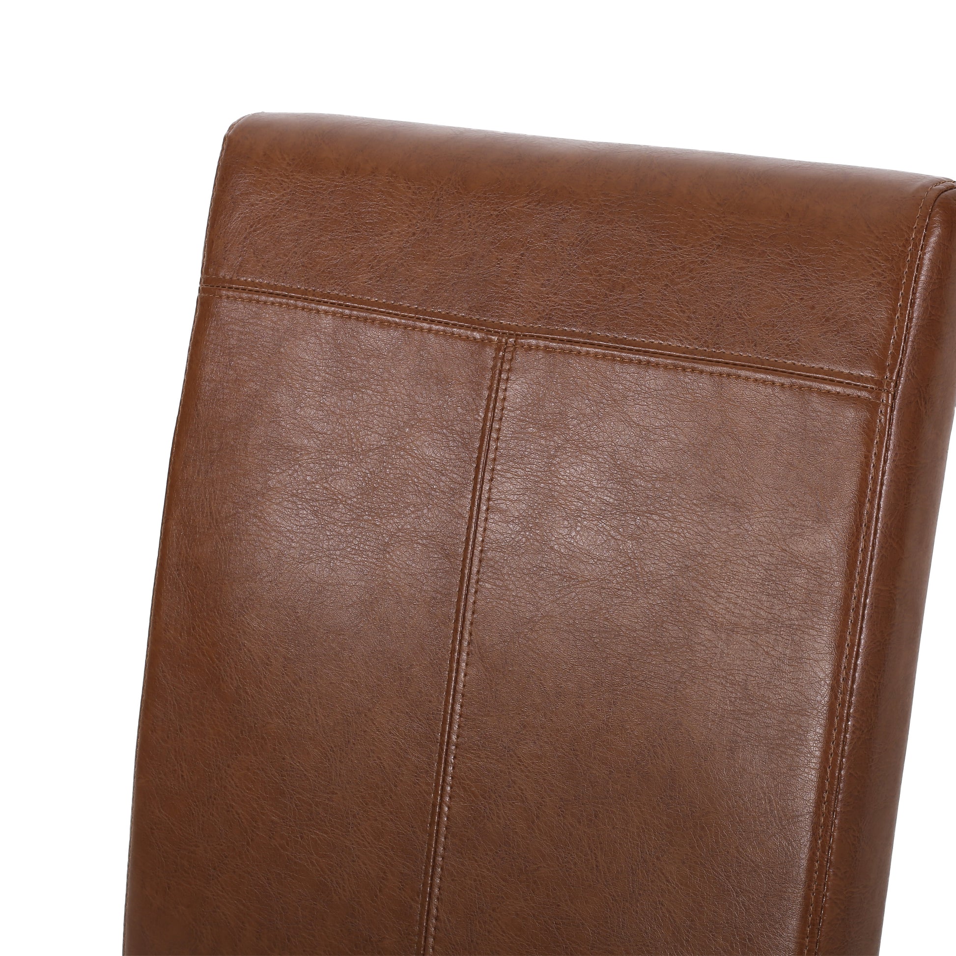 Closeup of a brown faux leather dining chair back with detailed stitching