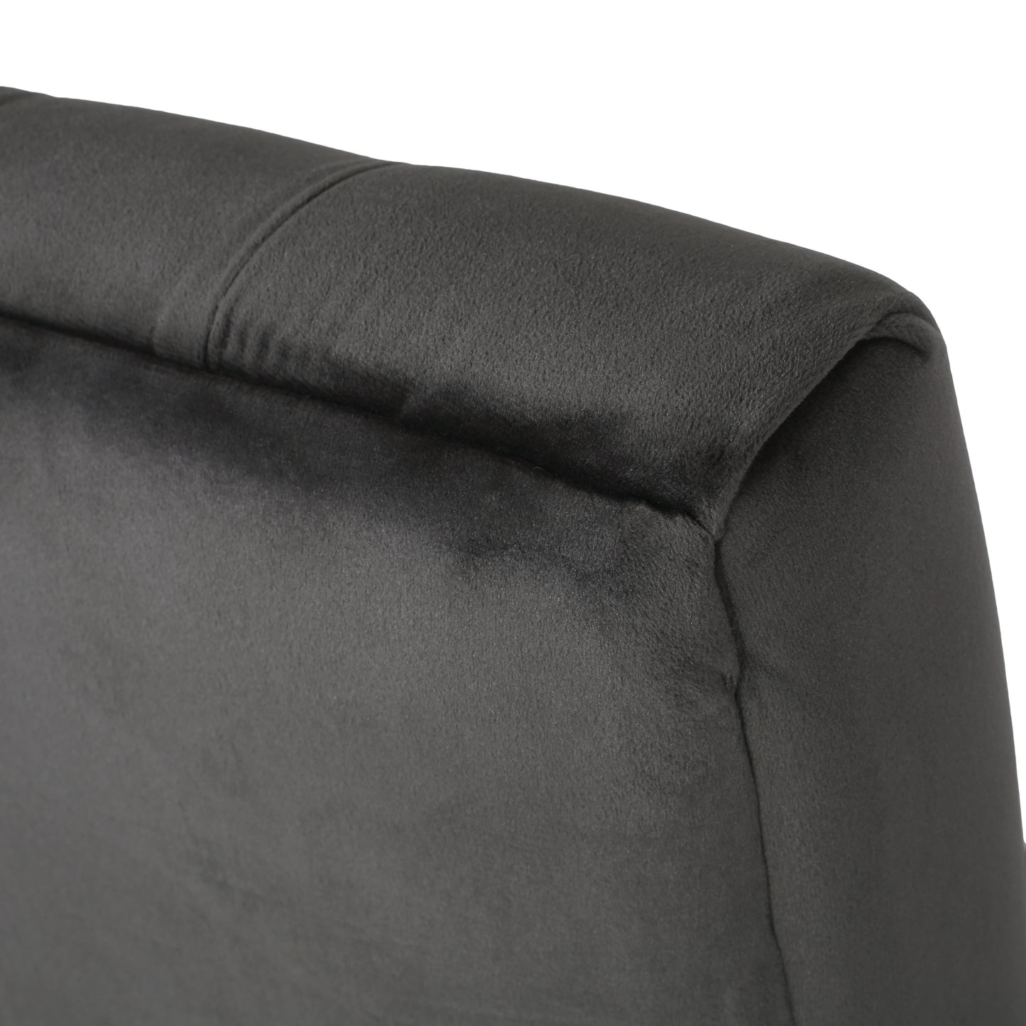 Closeup of charcoal gray velvet fabric headboard upholstery with subtle stitching detail