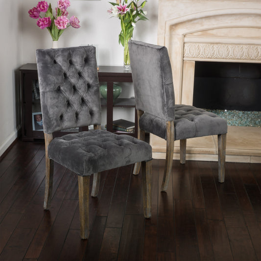 Elegant tufted velvet dining chair in dark grey with wooden legs