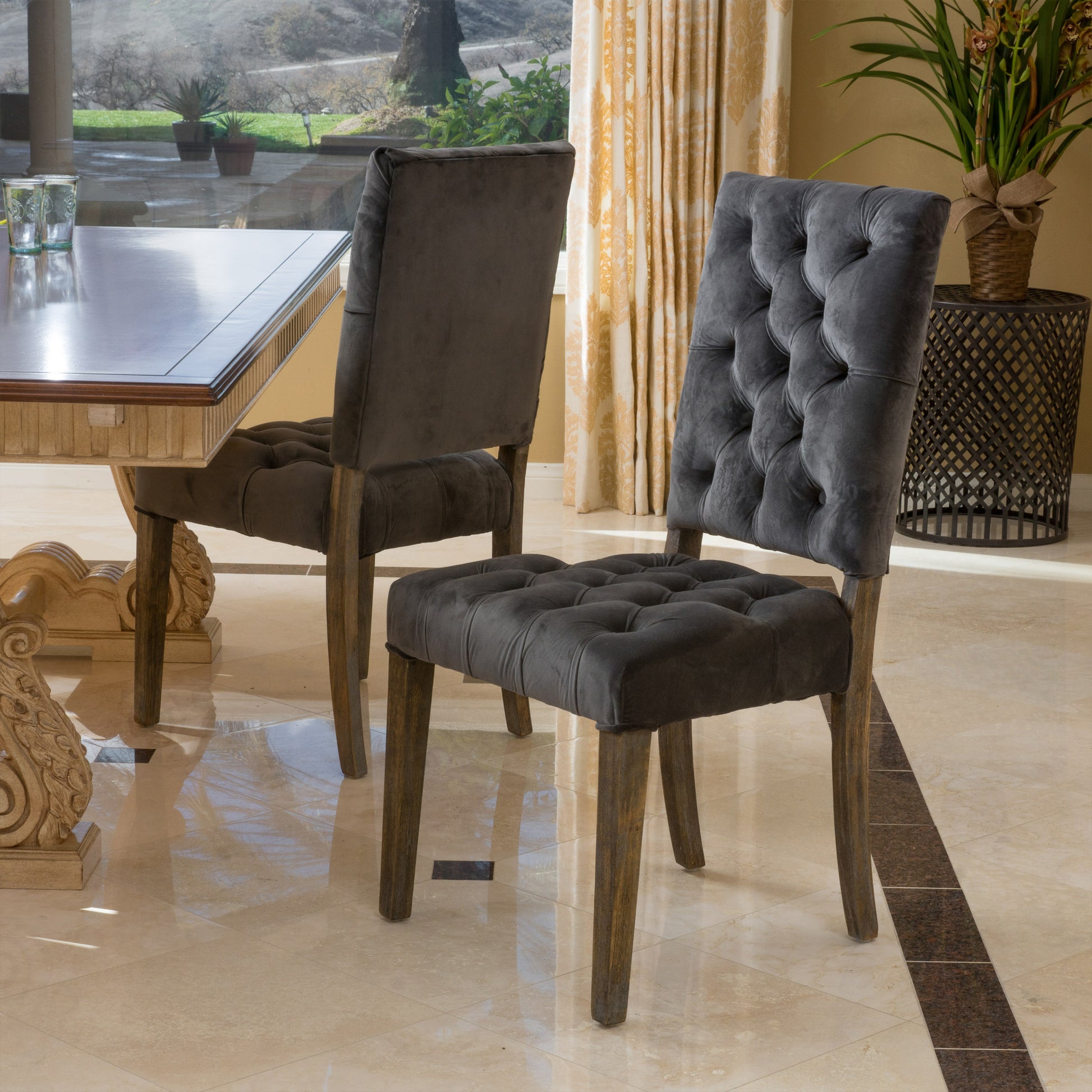 Dark gray velvet tufted dining chair with wooden legs elegant design