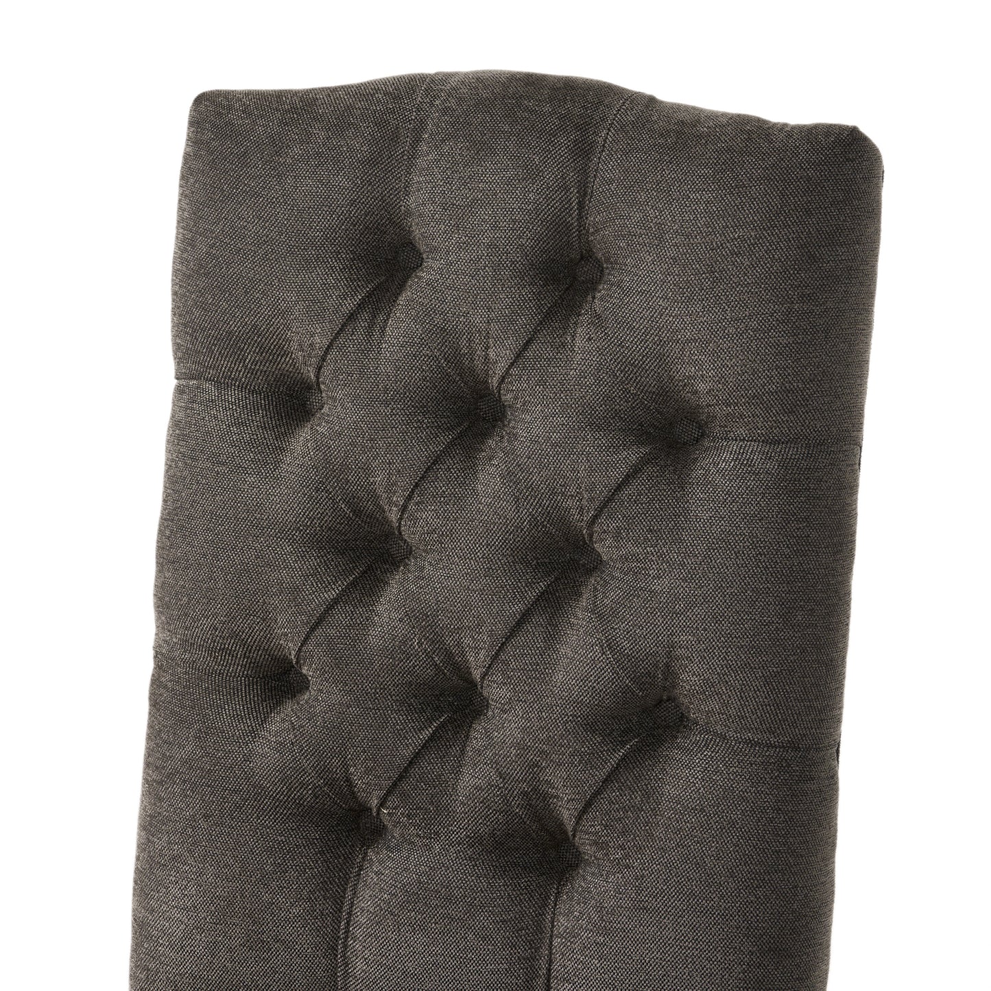 Dark grey tufted upholstered chair back with textured fabric detail