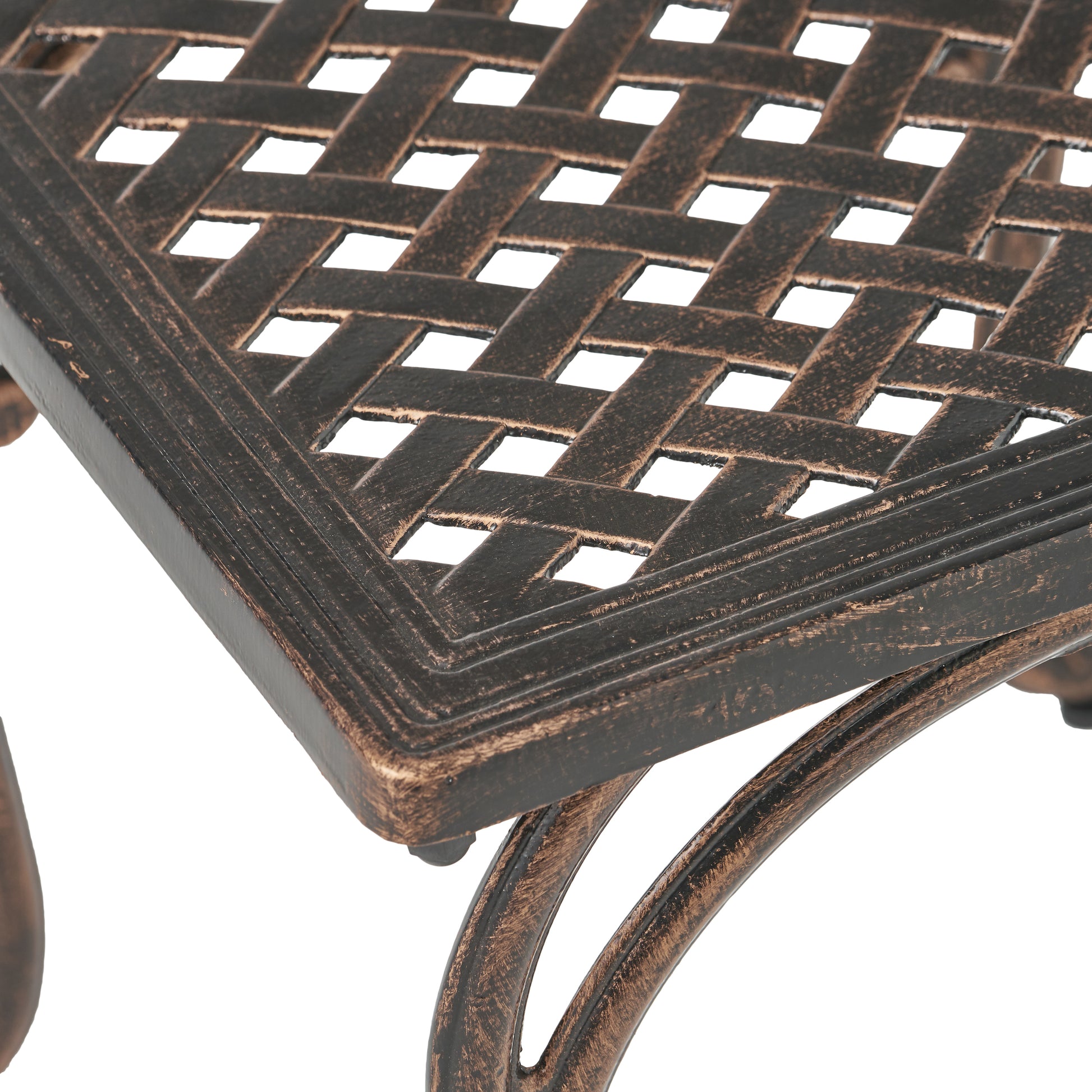 Close up of bronze lattice weave patio table top with ornate scrolling legs