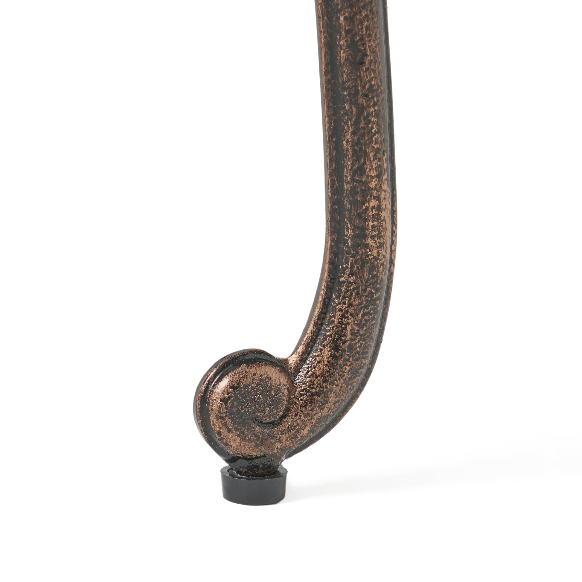 Bronze ornate scrollwork furniture leg with black protective foot