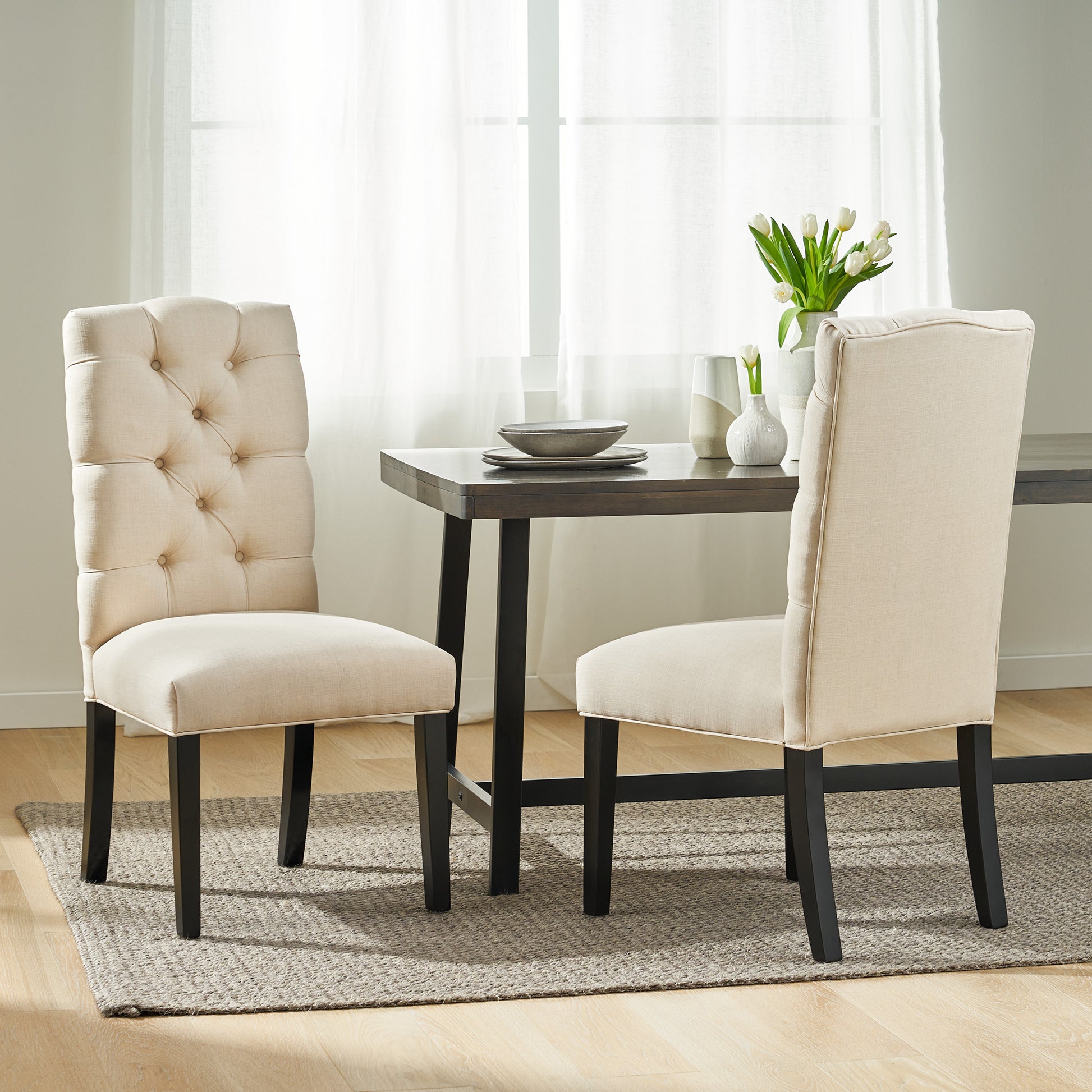 Tufted beige fabric dining chair with dark wood legs elegant and comfortable