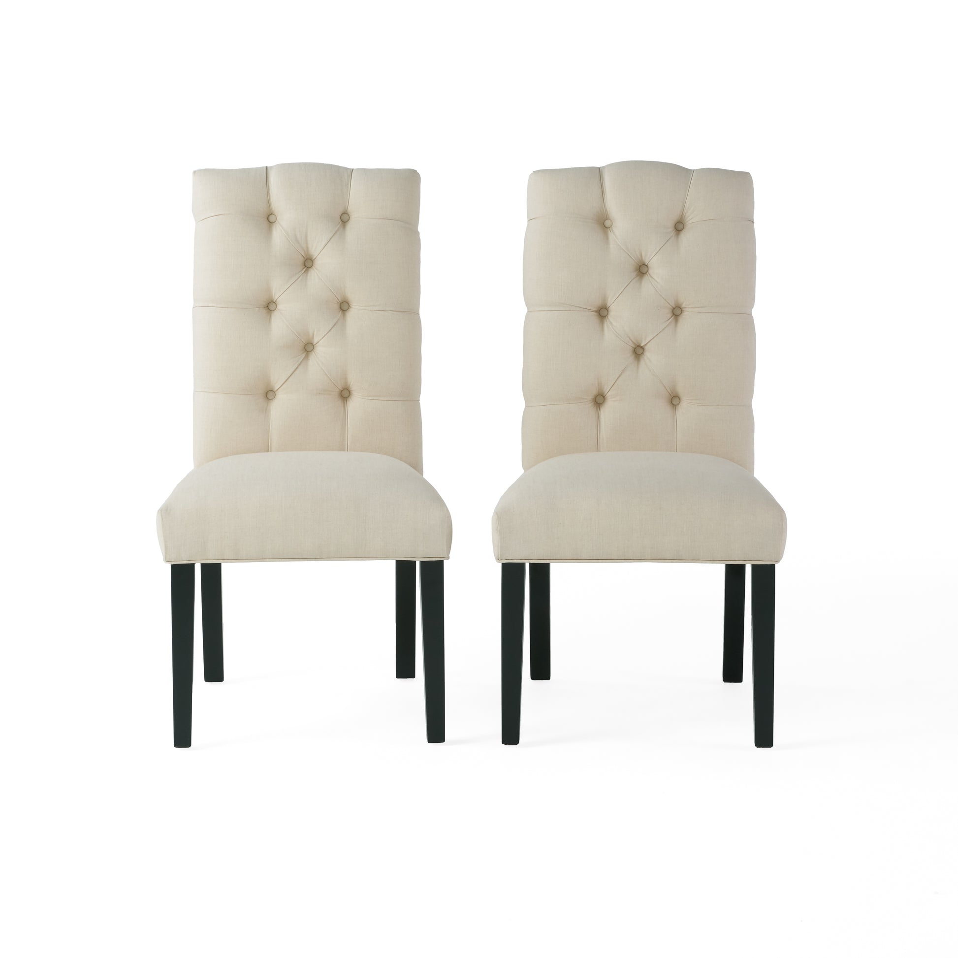 Pair of beige linen upholstered dining chairs with tufted backs and dark wood legs