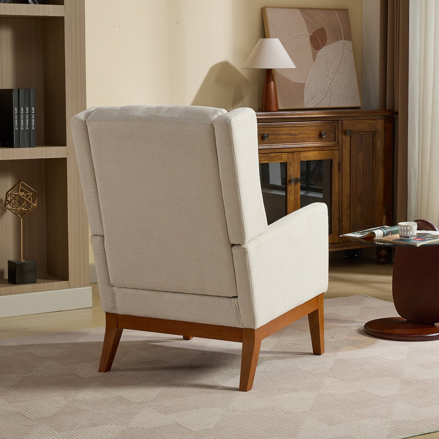 Beige upholstered accent chair with tapered wooden legs perfect for living rooms