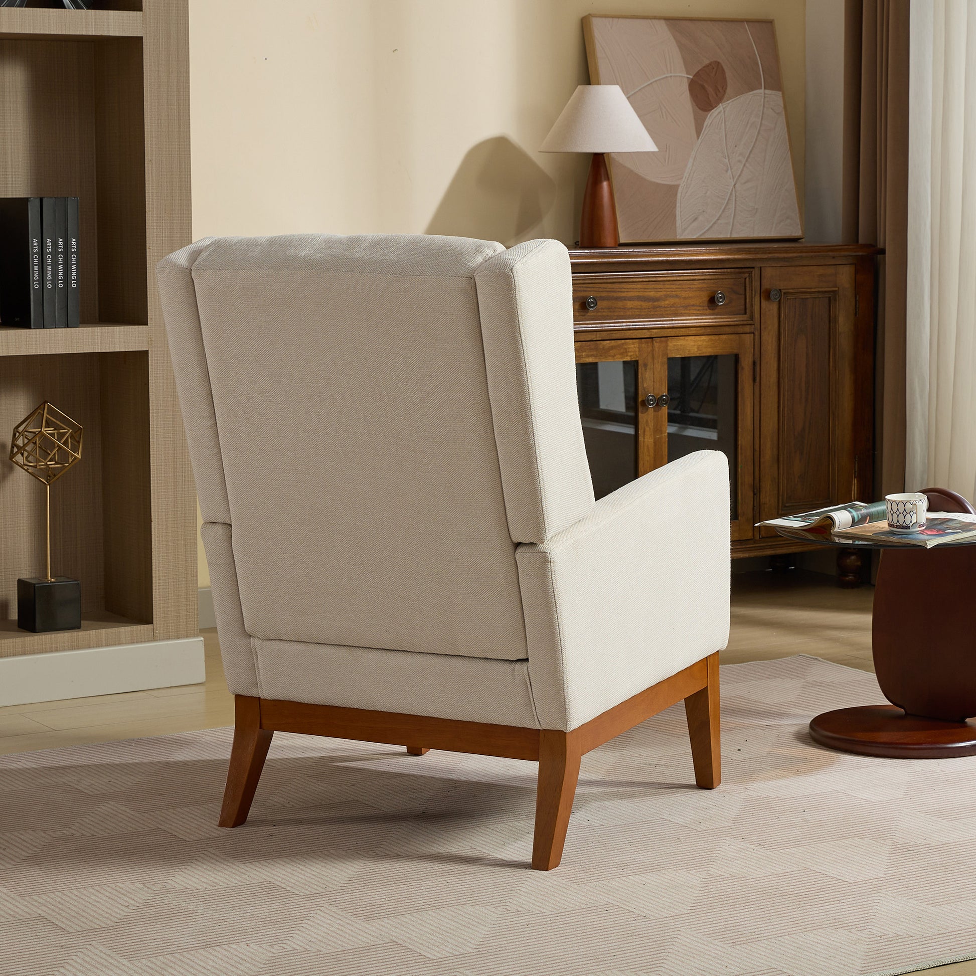 Beige upholstered accent chair with tapered wooden legs perfect for living rooms