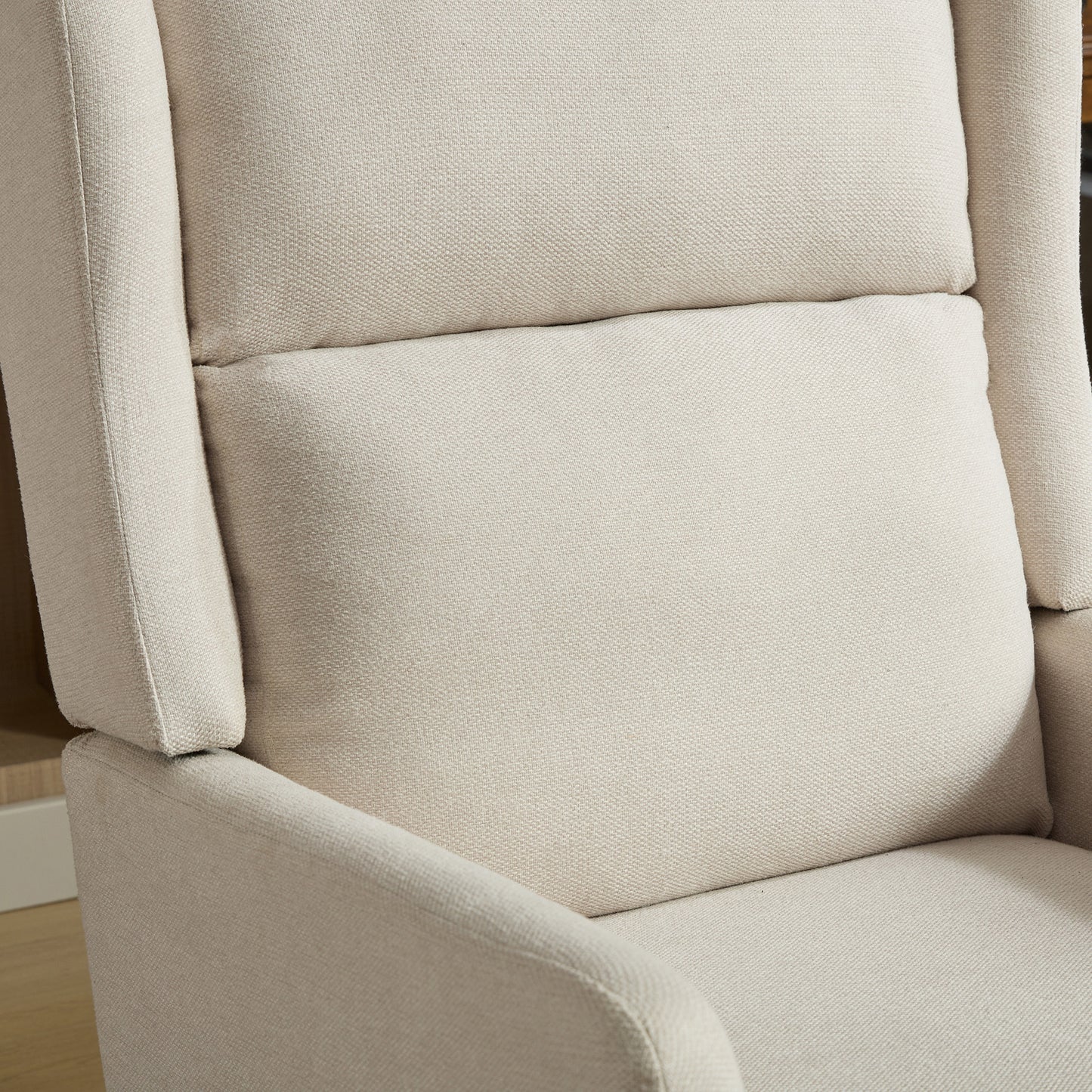 Cream upholstered accent chair with textured fabric and lumbar pillow