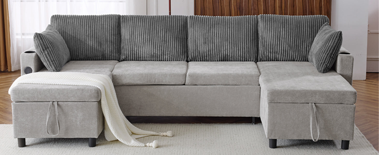 Gray corduroy sectional sofa with storage ottomans and a white knit blanket draped over the arm