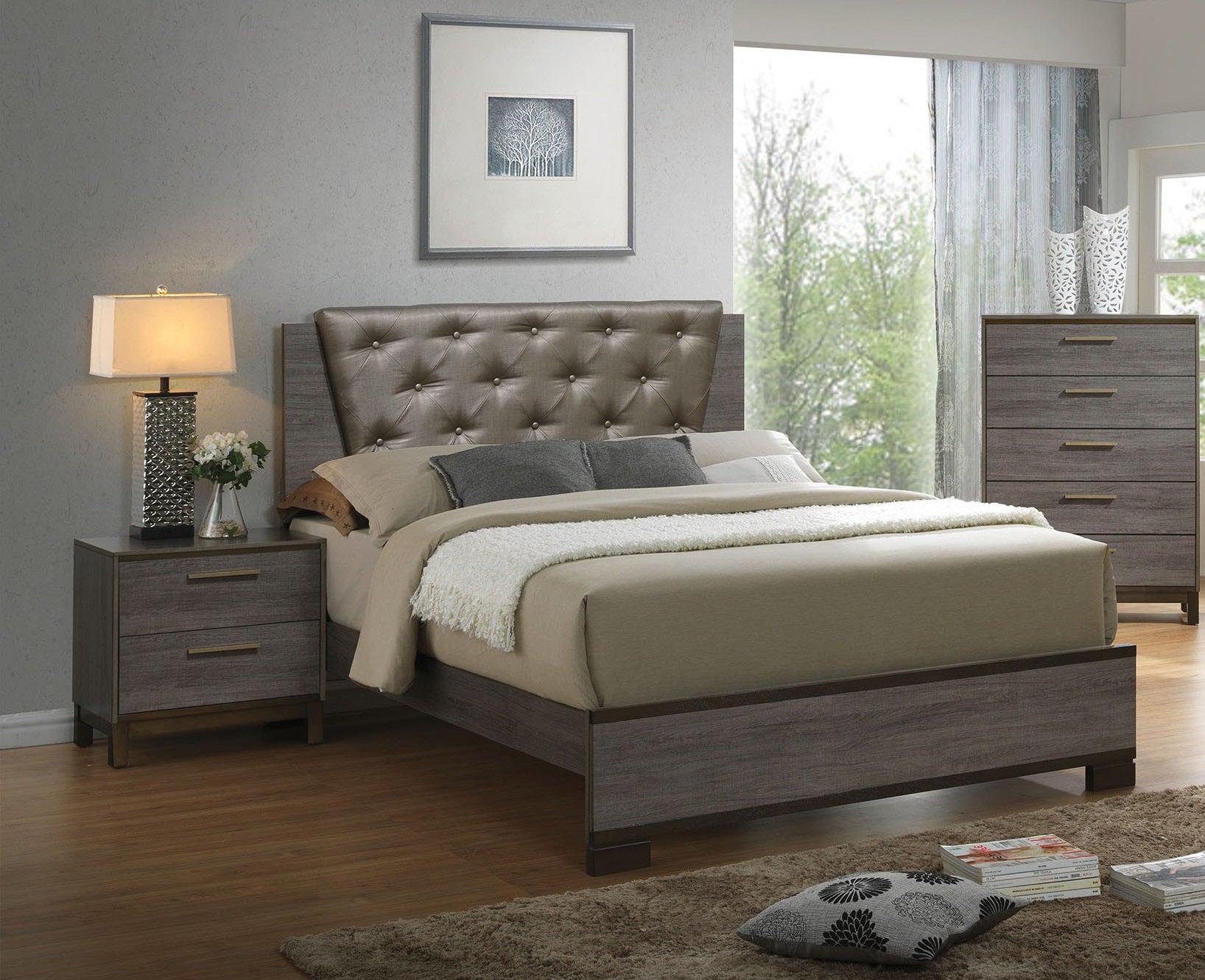 Tufted grey leather headboard on a queen size bed with wood frame