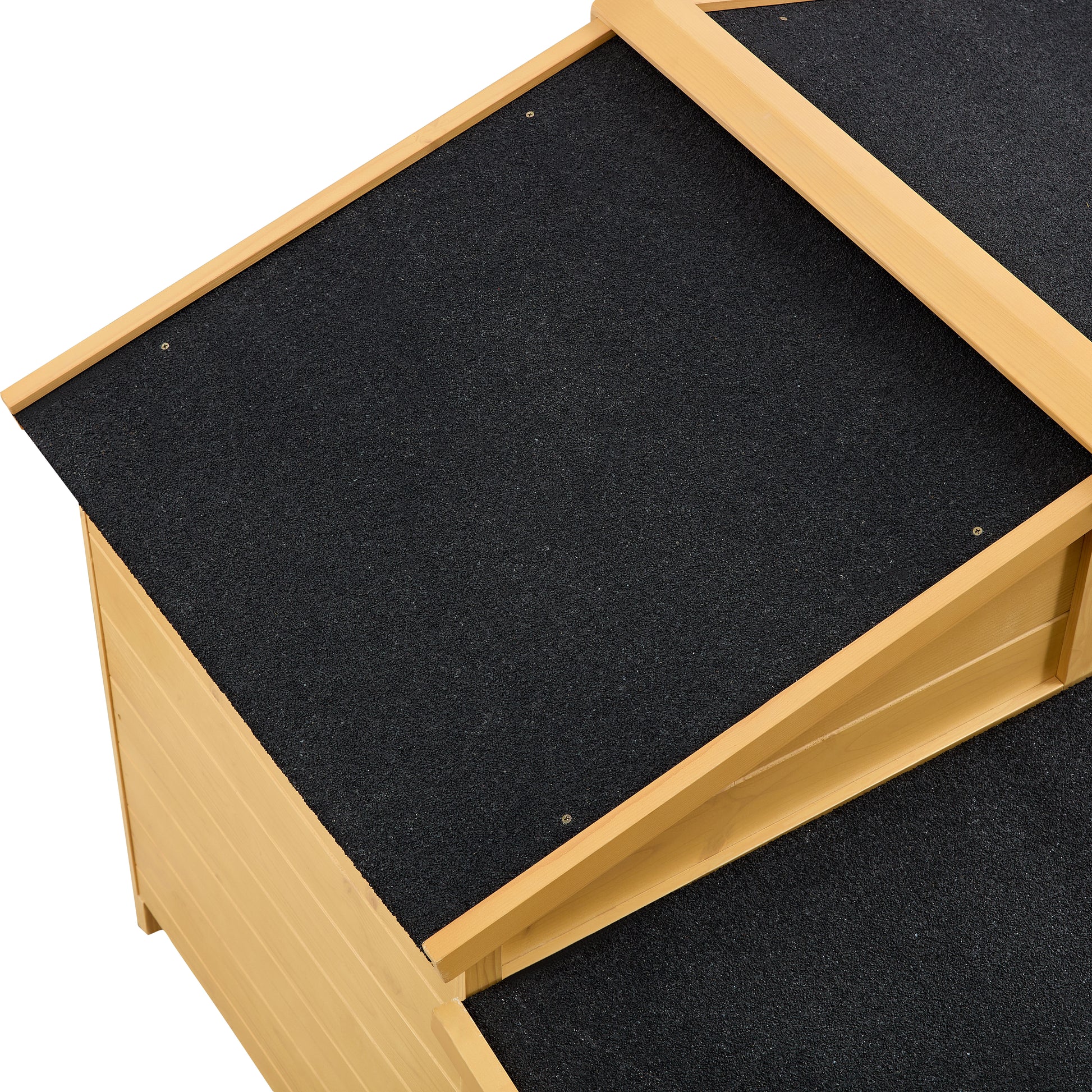 Wooden dog house with black asphalt roof detail providing weather protection for pets