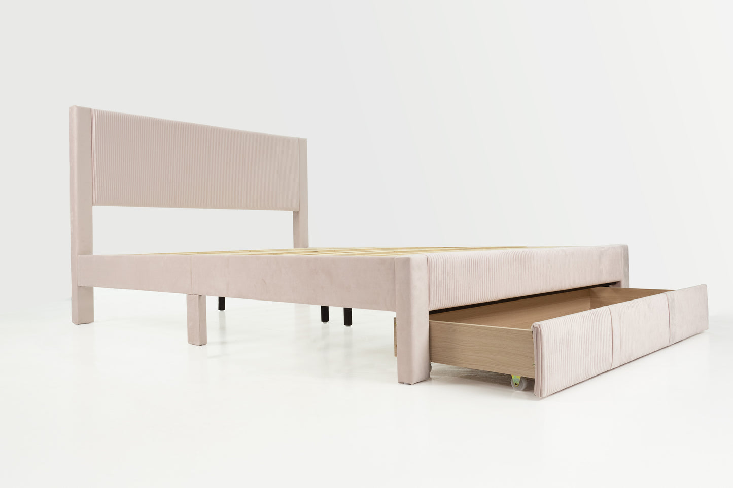 Light pink velvet bed frame with builtin storage drawer and fluted headboard