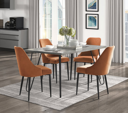 Modern dining set with four orange velvet chairs and a grey stonelook table