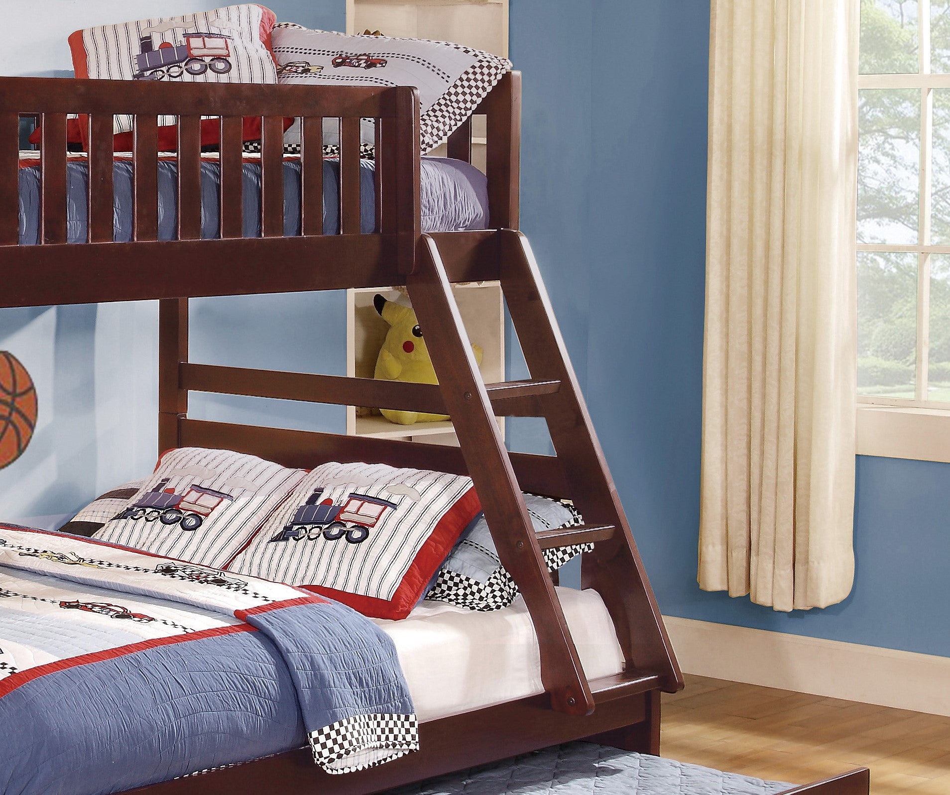 Dark wood bunk bed with trainthemed pillows for childrens room