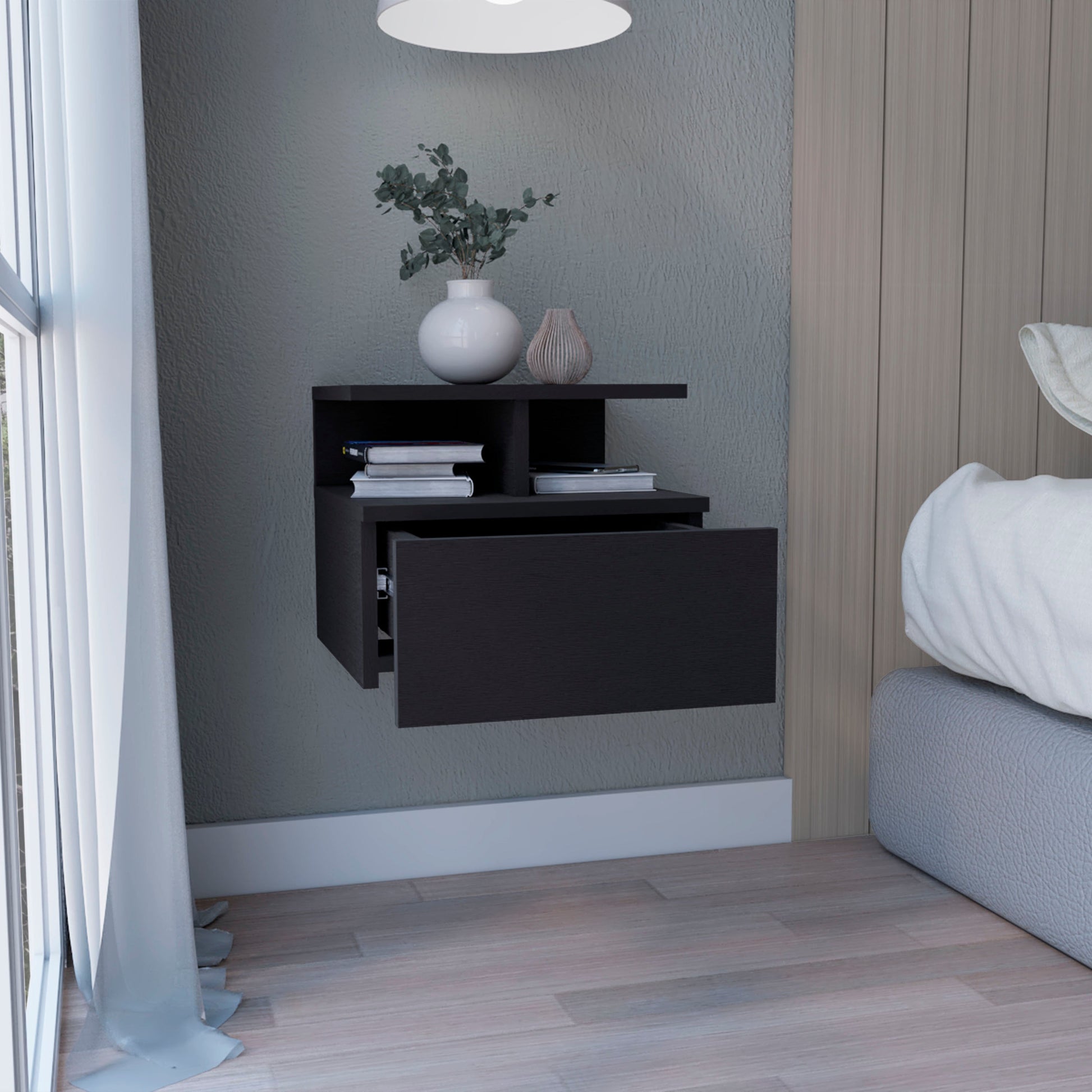 Dark grey floating nightstand with open shelves and a drawer
