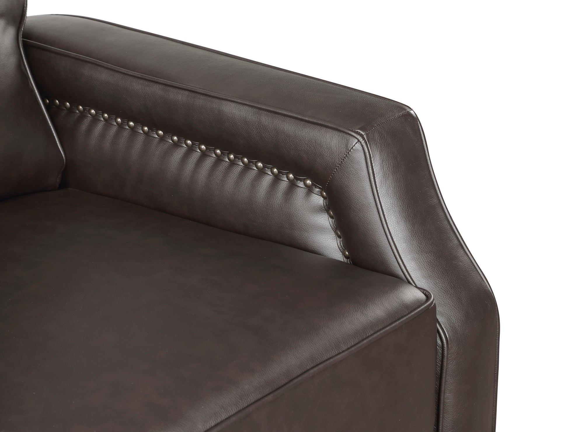 Dark brown leather armchair armrest with decorative nailhead trim closeup view