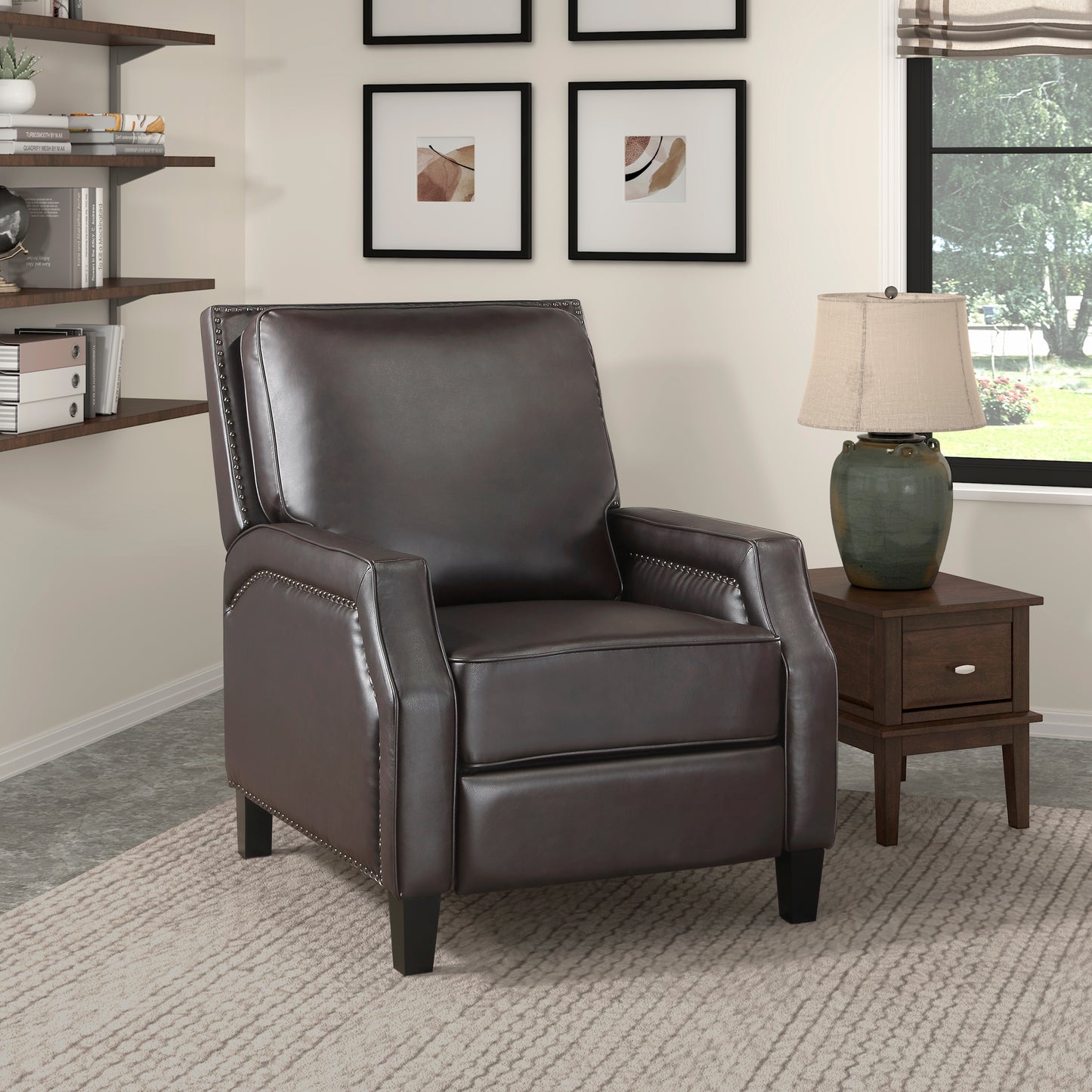 Dark brown leather recliner chair with silver nailhead trim detail