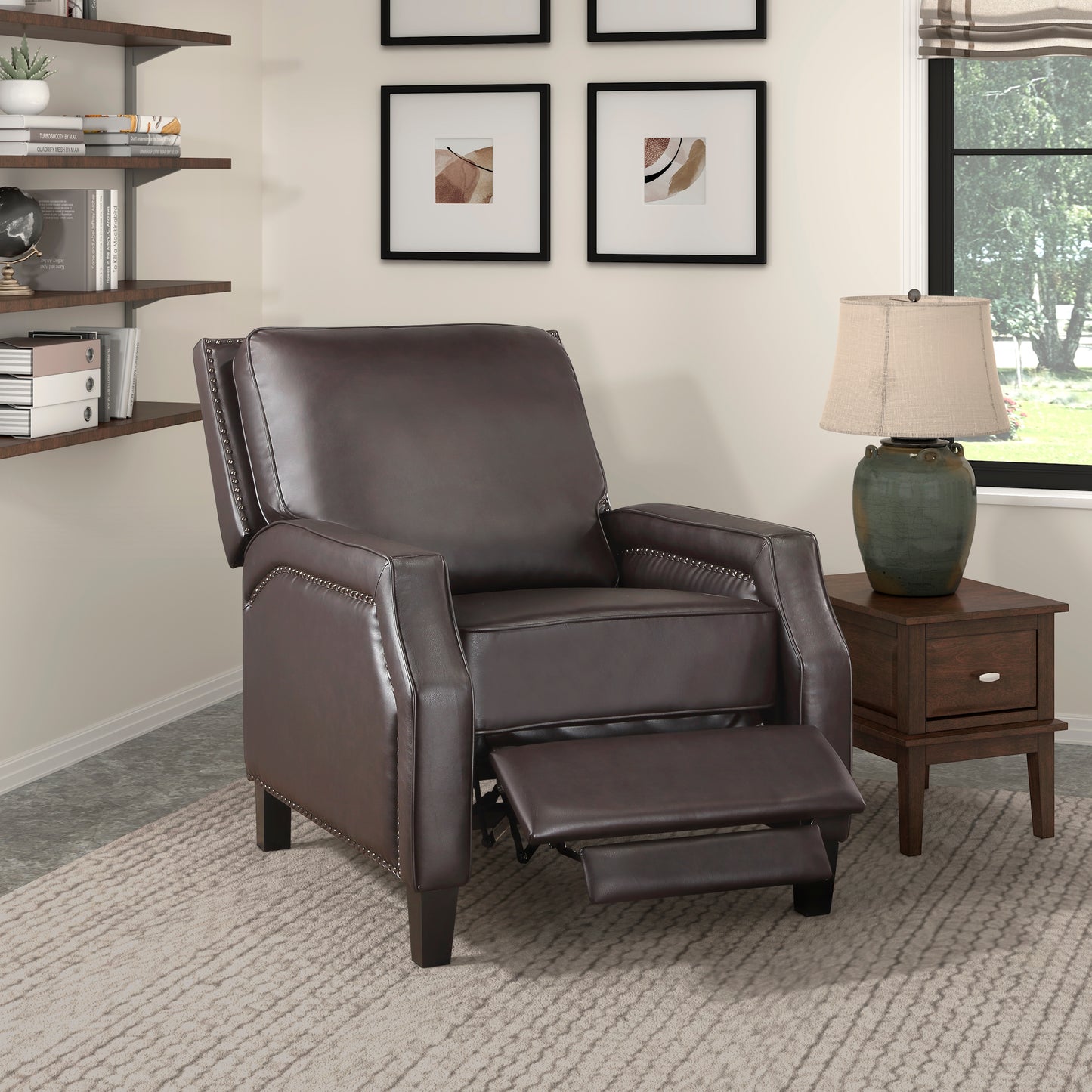 Dark brown faux leather recliner chair with decorative nailhead trim and extended footrest