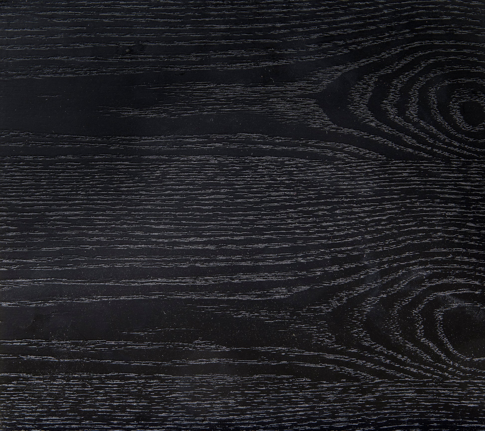 Textured black wood grain surface for furniture showcasing subtle linear patterns