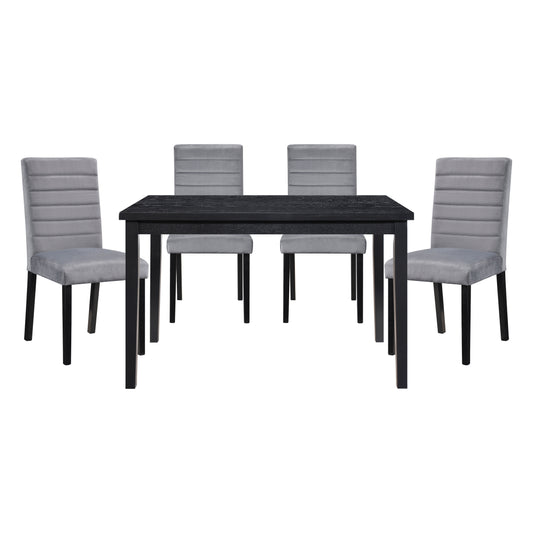 Black wood dining table with four upholstered grey velvet chairs
