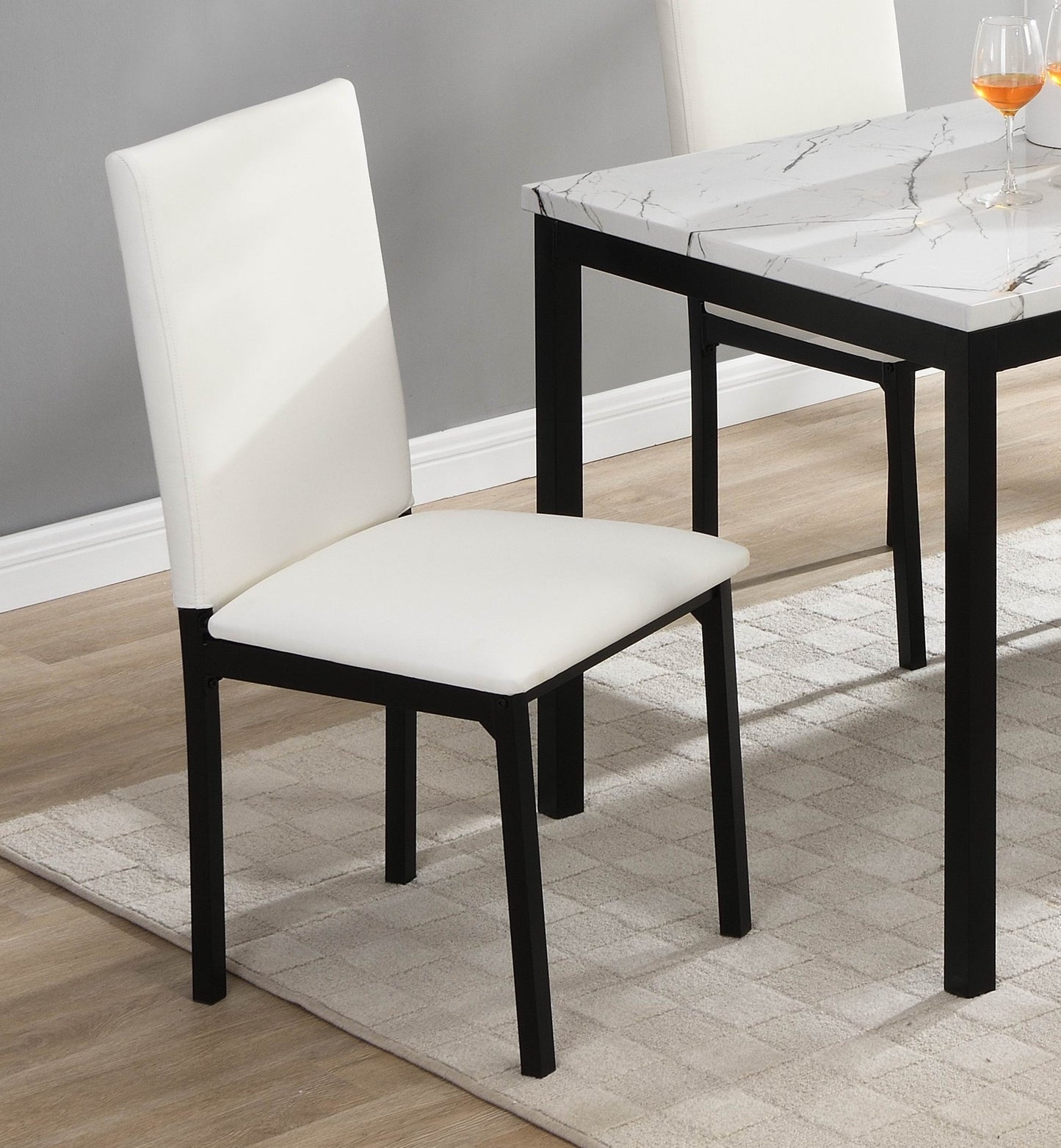White upholstered dining chair with black metal legs