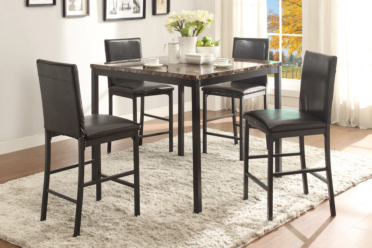 Square marble top bar table with four black faux leather stools