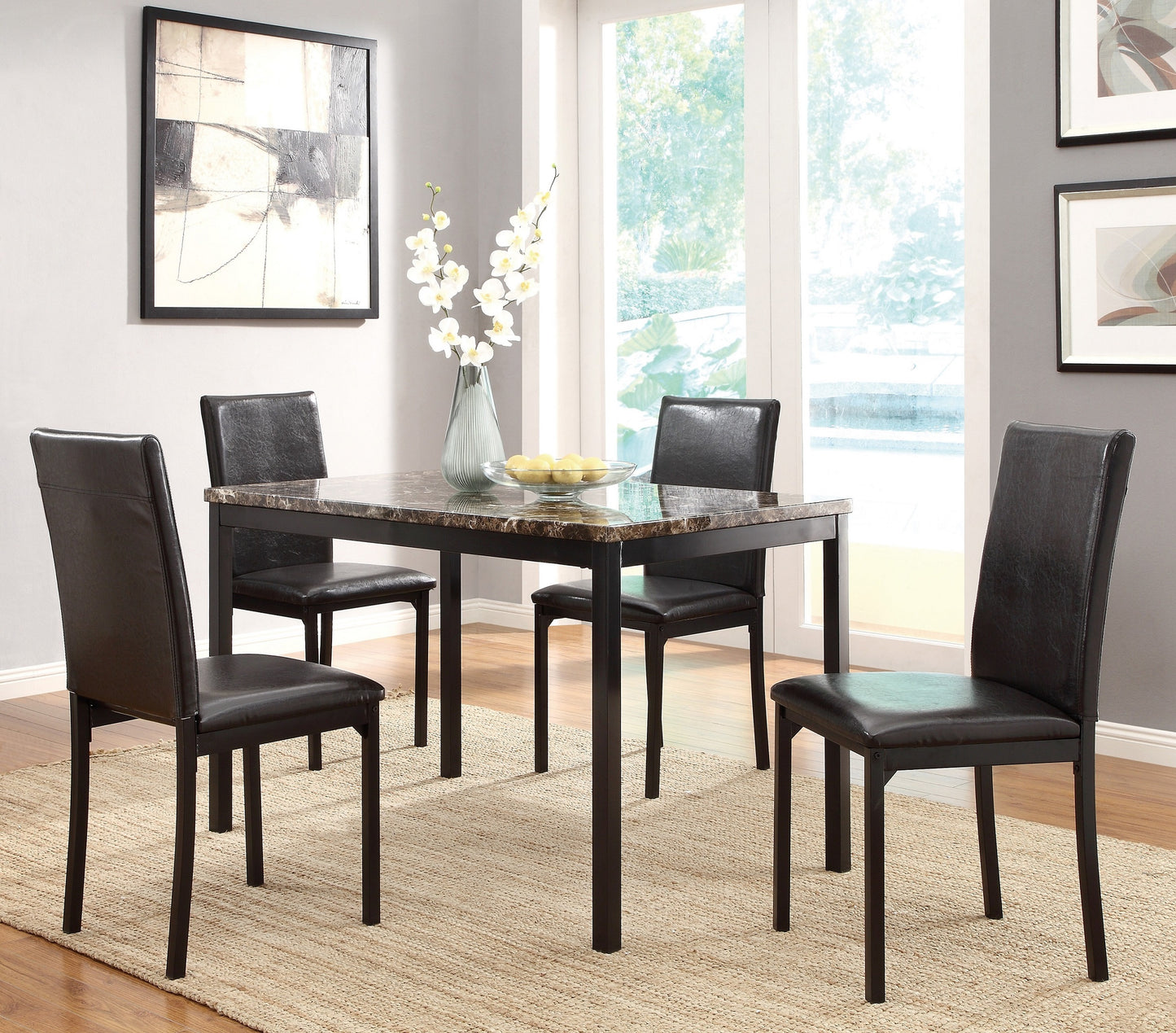 Dark brown faux leather dining chairs around a marbletop kitchen table set