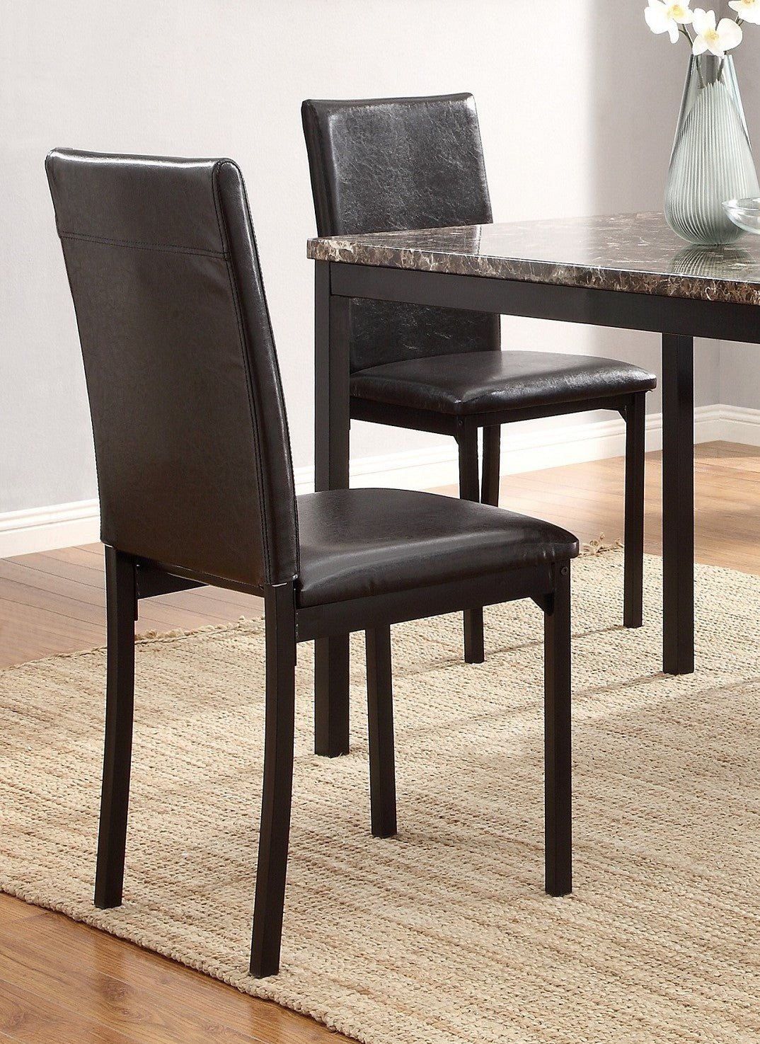 Dark brown faux leather dining chair with sleek black metal frame modern design
