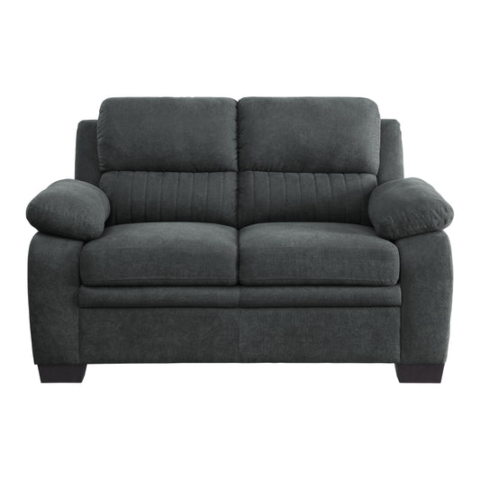 Dark grey fabric twoseater sofa with plush cushions and stitched detailing