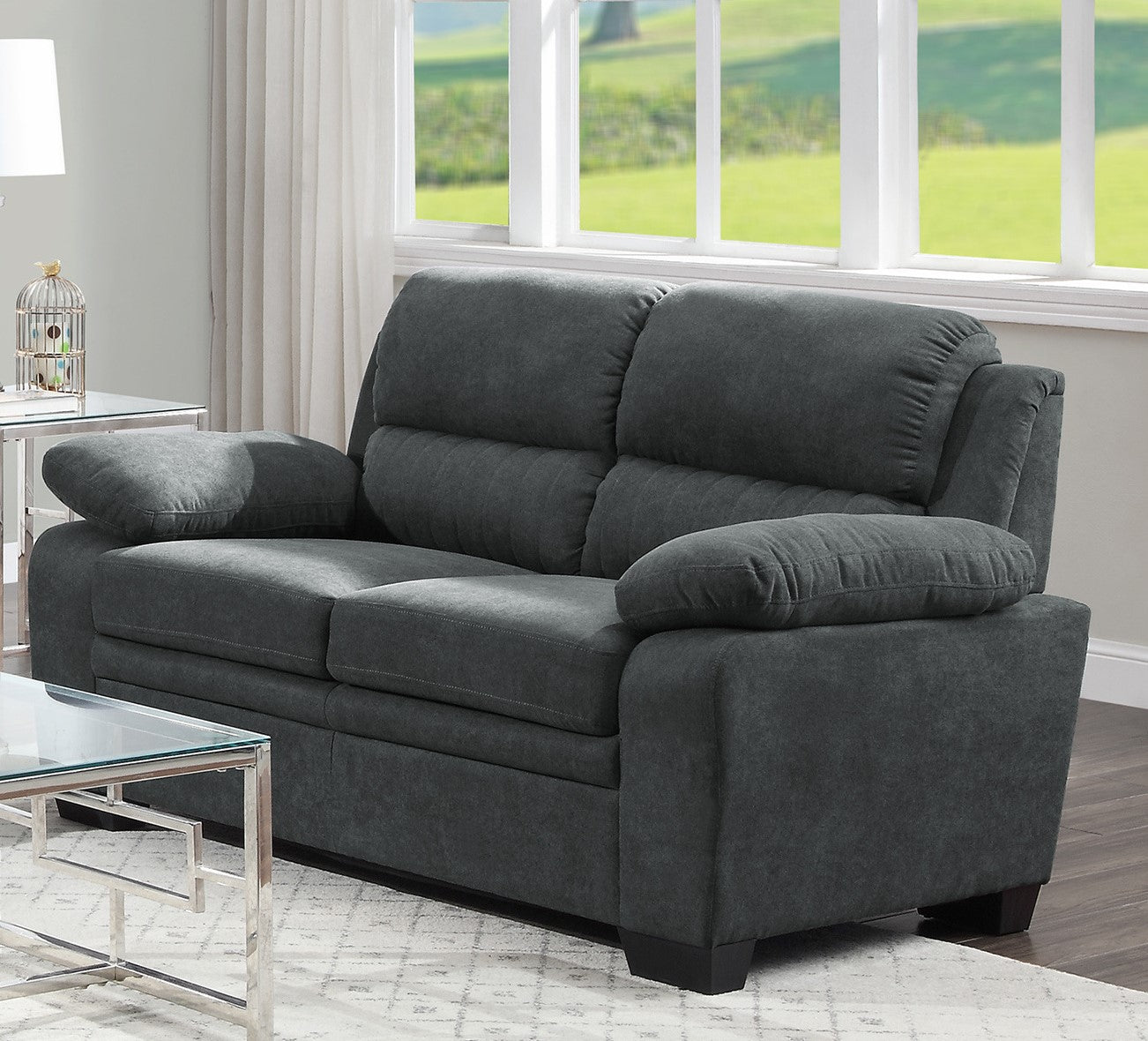 Dark gray upholstered sofa with plush cushions perfect for modern living rooms