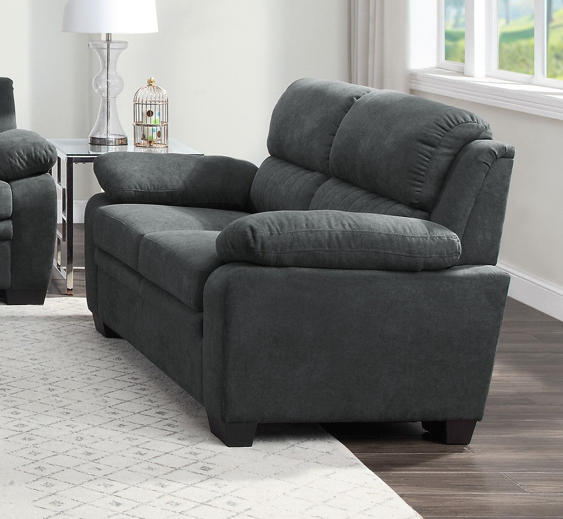 Charcoal grey upholstered loveseat with plush cushions and clean lines