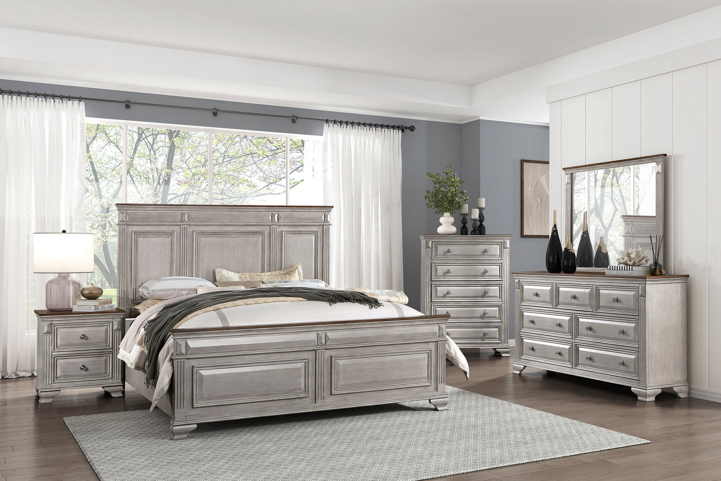 Antique white kingsize bed frame with carved details and dark wood accents perfect for a master bedroom