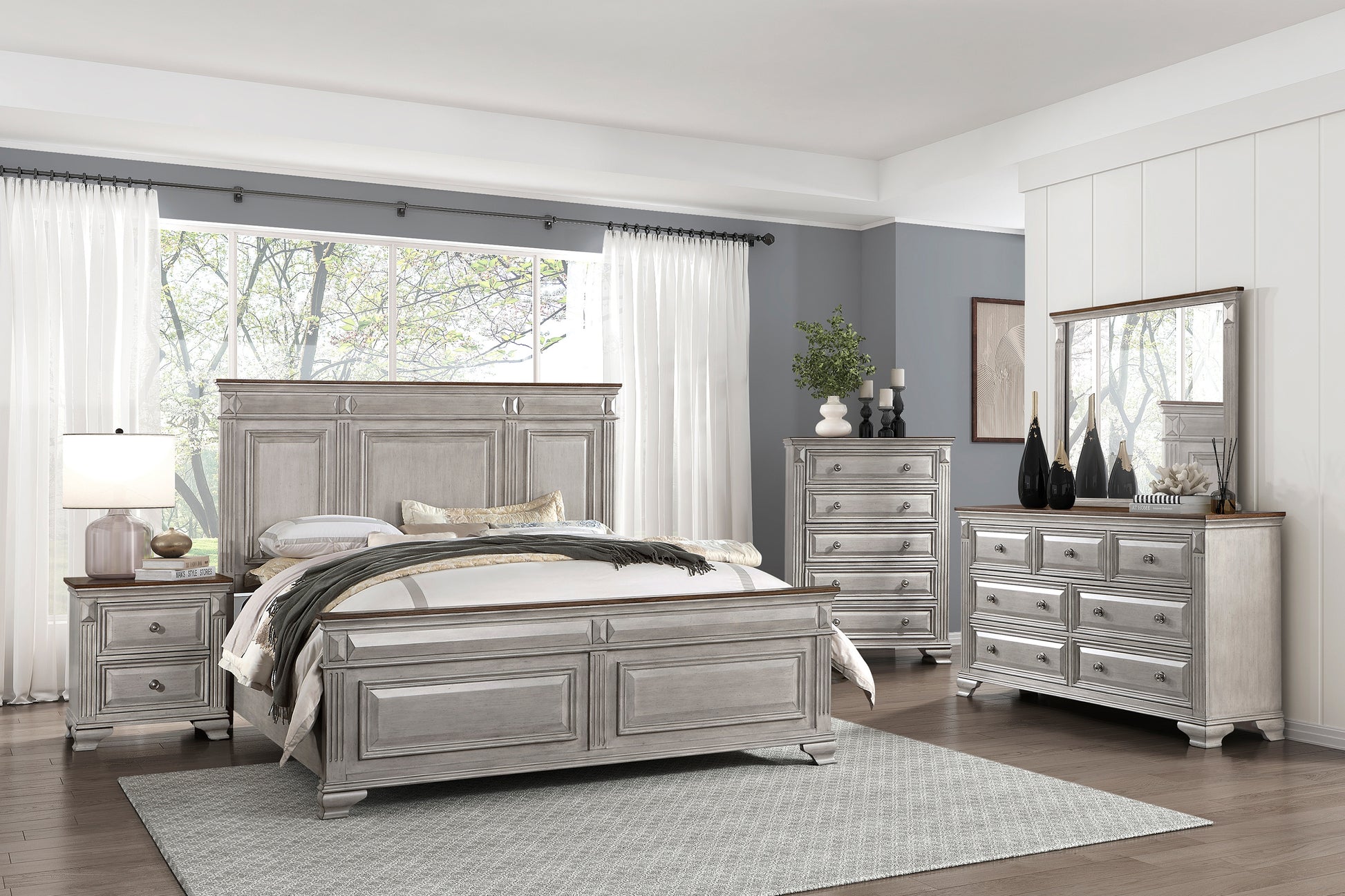 Antique white kingsize bed frame with carved details and dark wood accents perfect for a master bedroom