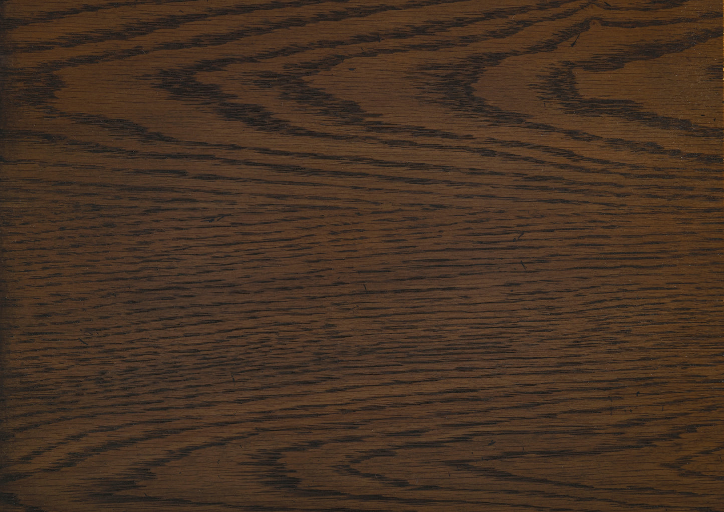 Dark oak wood grain texture deep brown with prominent black flecks suitable for flooring or furniture