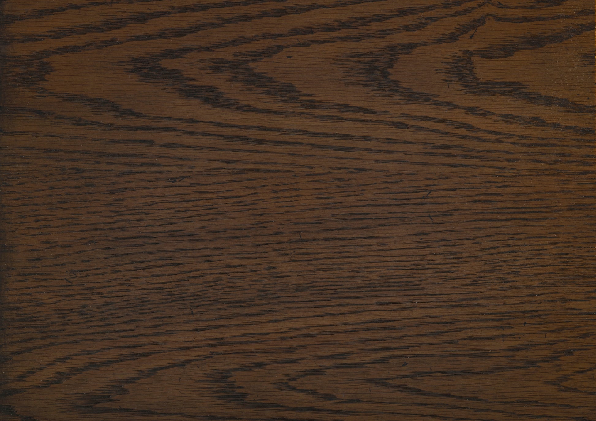 Dark oak wood grain texture deep brown with prominent black flecks suitable for flooring or furniture