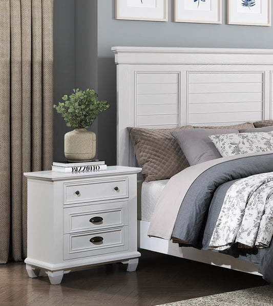 White wooden nightstand with three drawers perfect for bedroom storage
