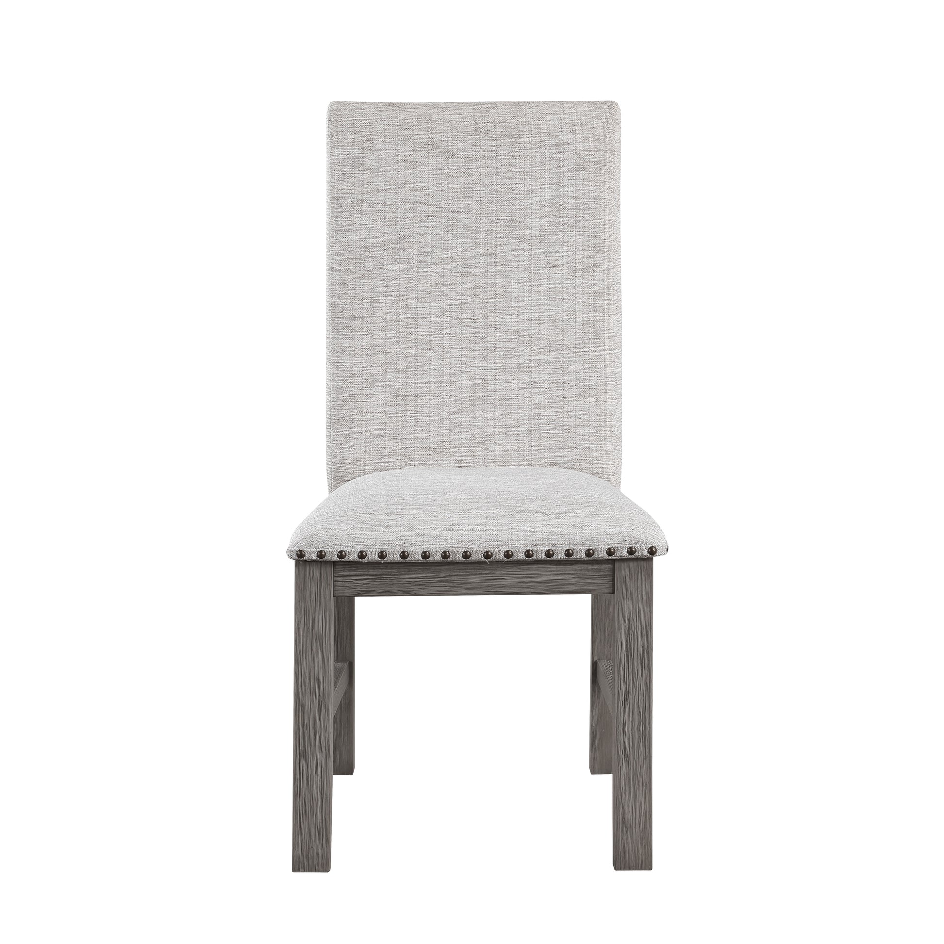 Pristine upholstered dining chair with grey textured fabric seat and tall back accented by nailhead trim and distressed wood legs