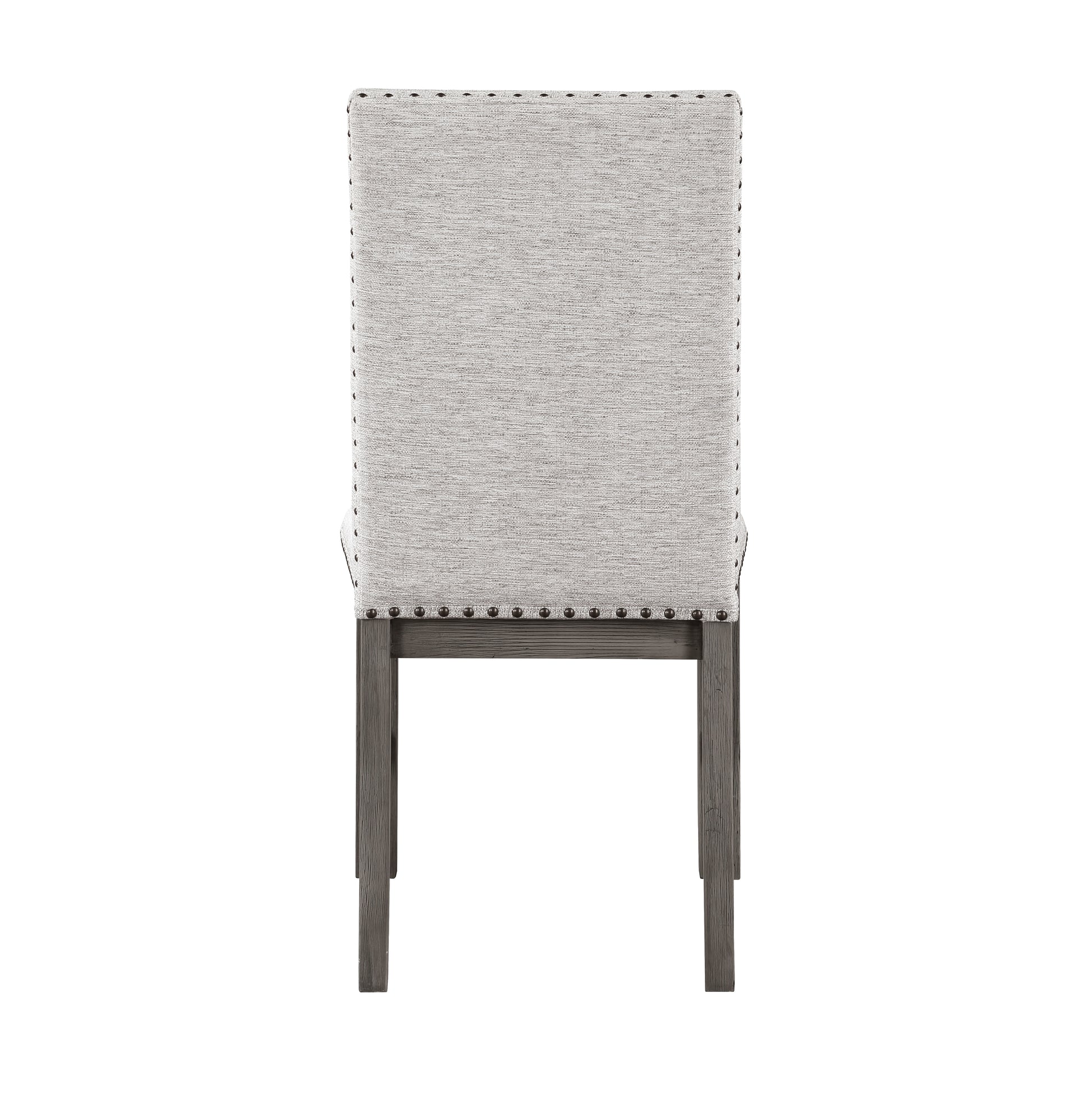 Back view of a tufted upholstered dining chair in light gray fabric with nailhead trim and dark wood legs