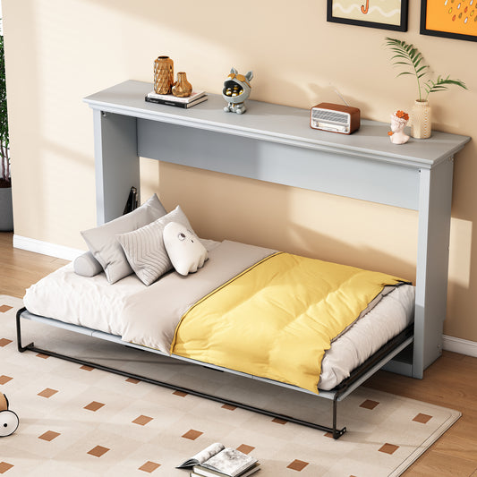Gray wall bed with a yellow blanket and assorted pillows on white bedding