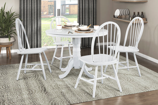 White wooden dining table set with four spindleback chairs perfect for casual dining