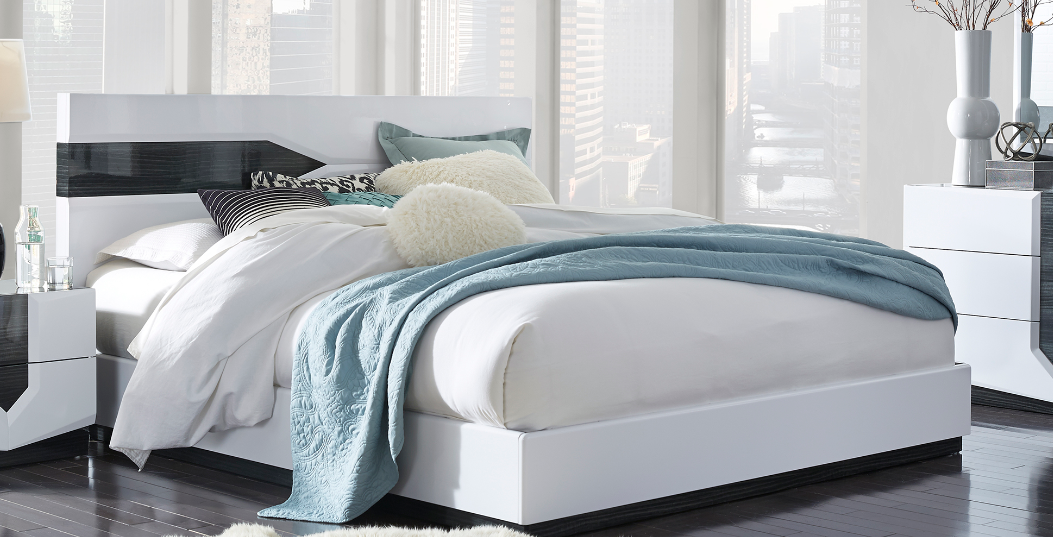 Modern white platform bed frame with glossy headboard detail queen size