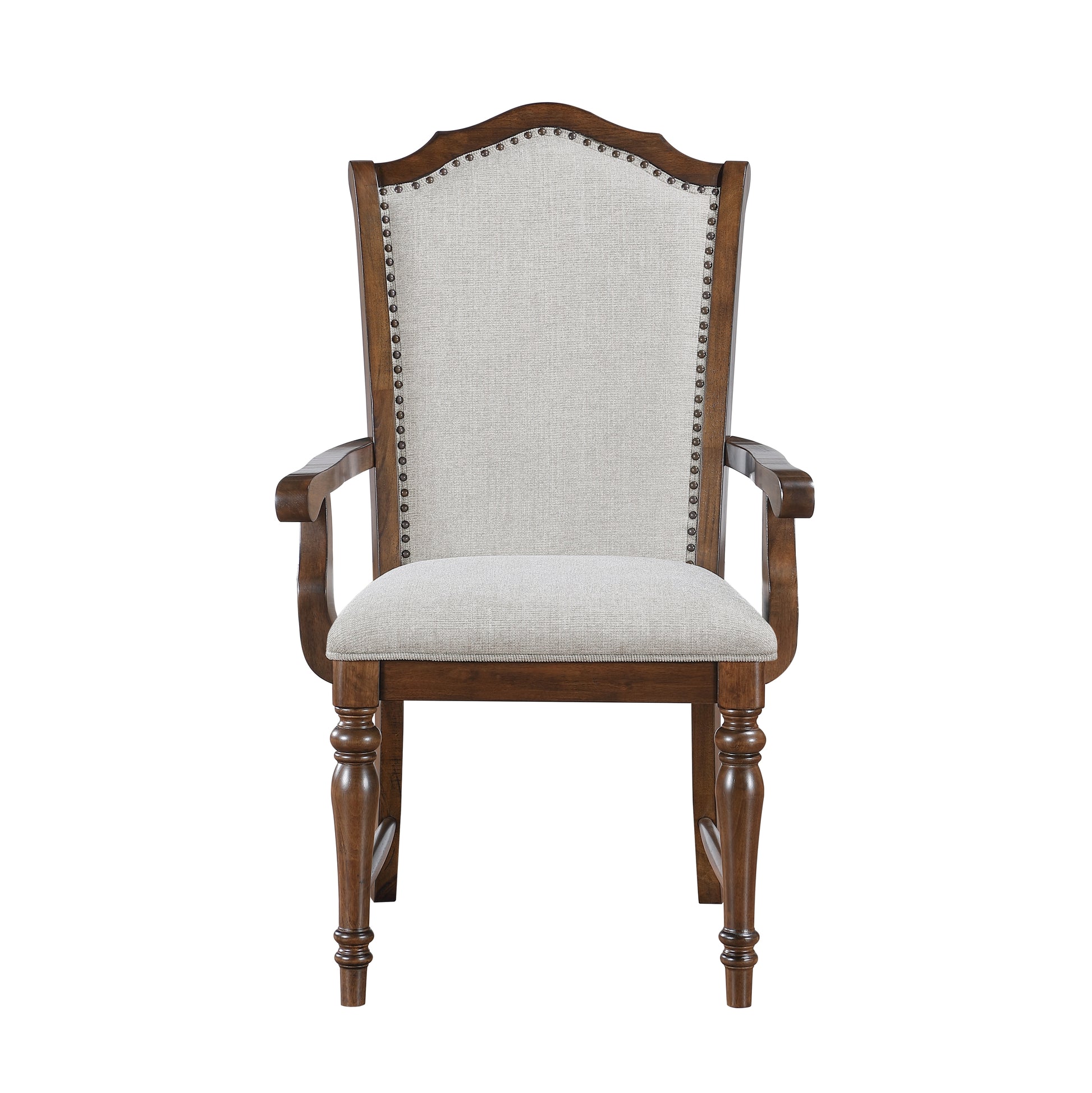 Upholstered dining chair with carved wooden frame and nailhead trim