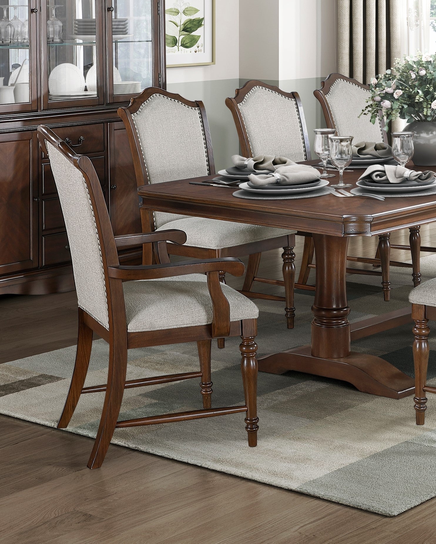 Tufted upholstered dining chair with dark wood frame and silver nailhead trim