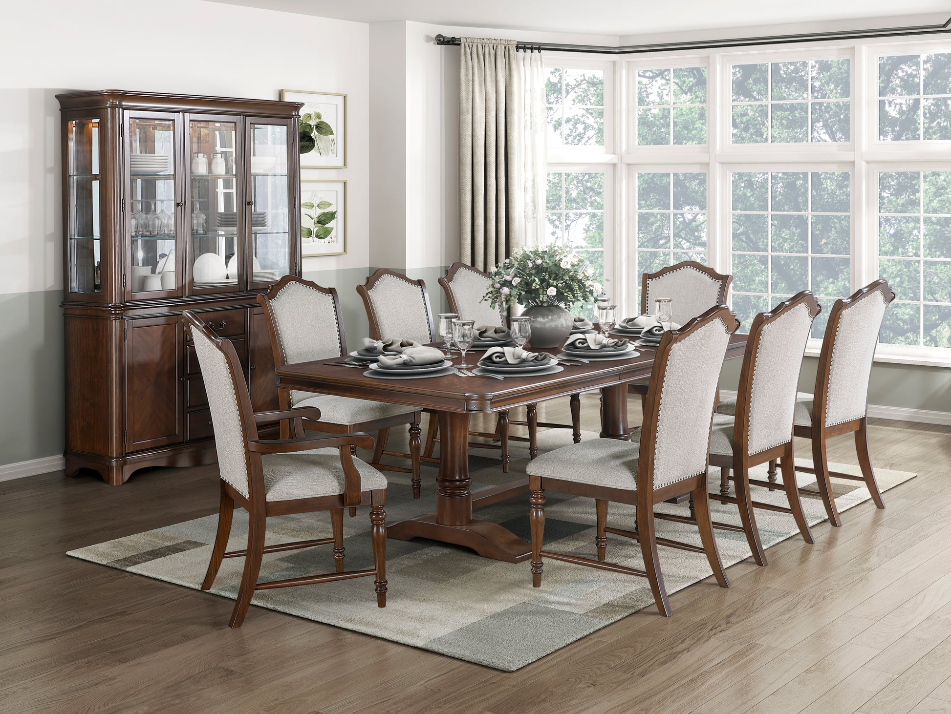 Elegant dark wood dining table with upholstered chairs set for a formal meal