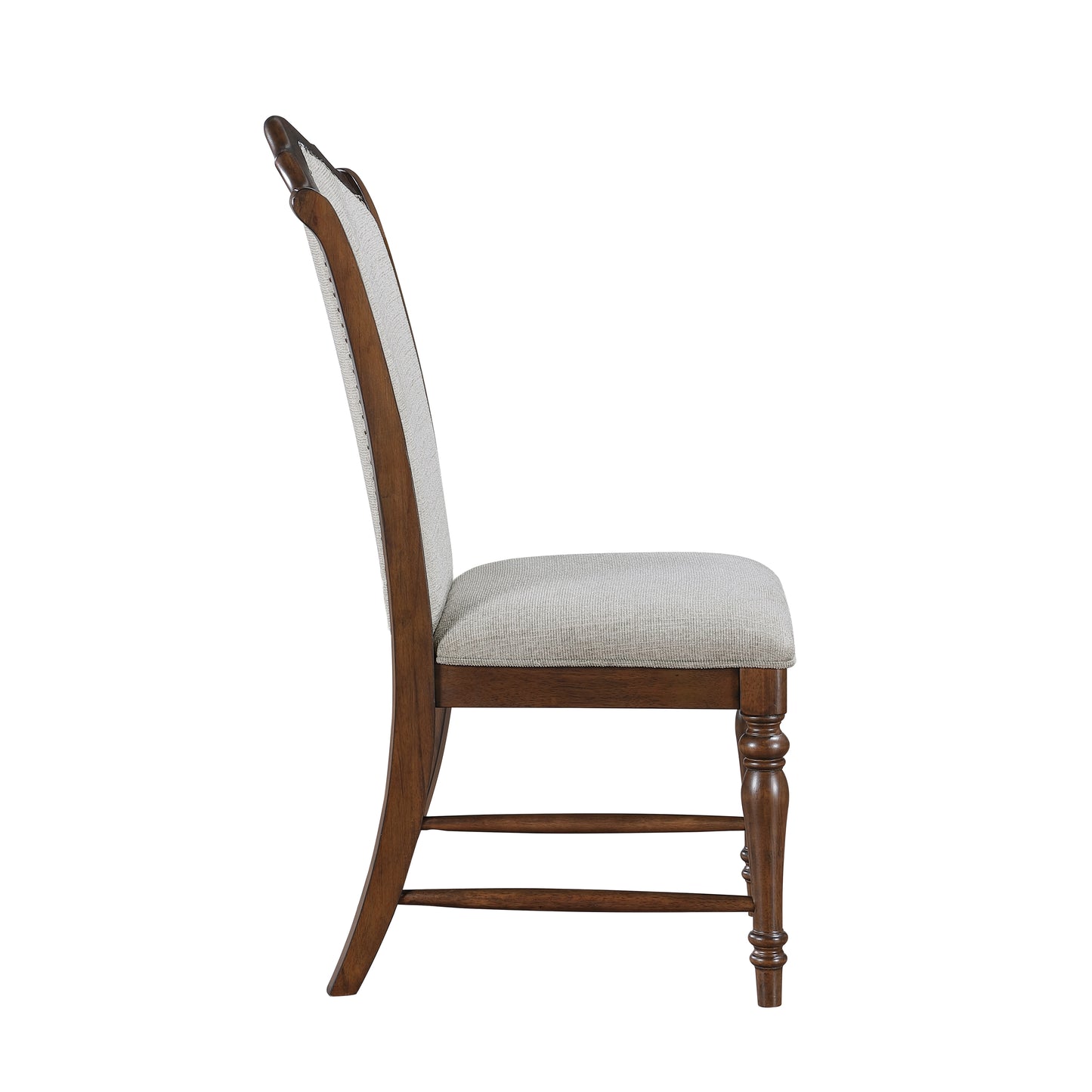 Traditional dining chair with carved wooden legs and a neutral fabric upholstered seat