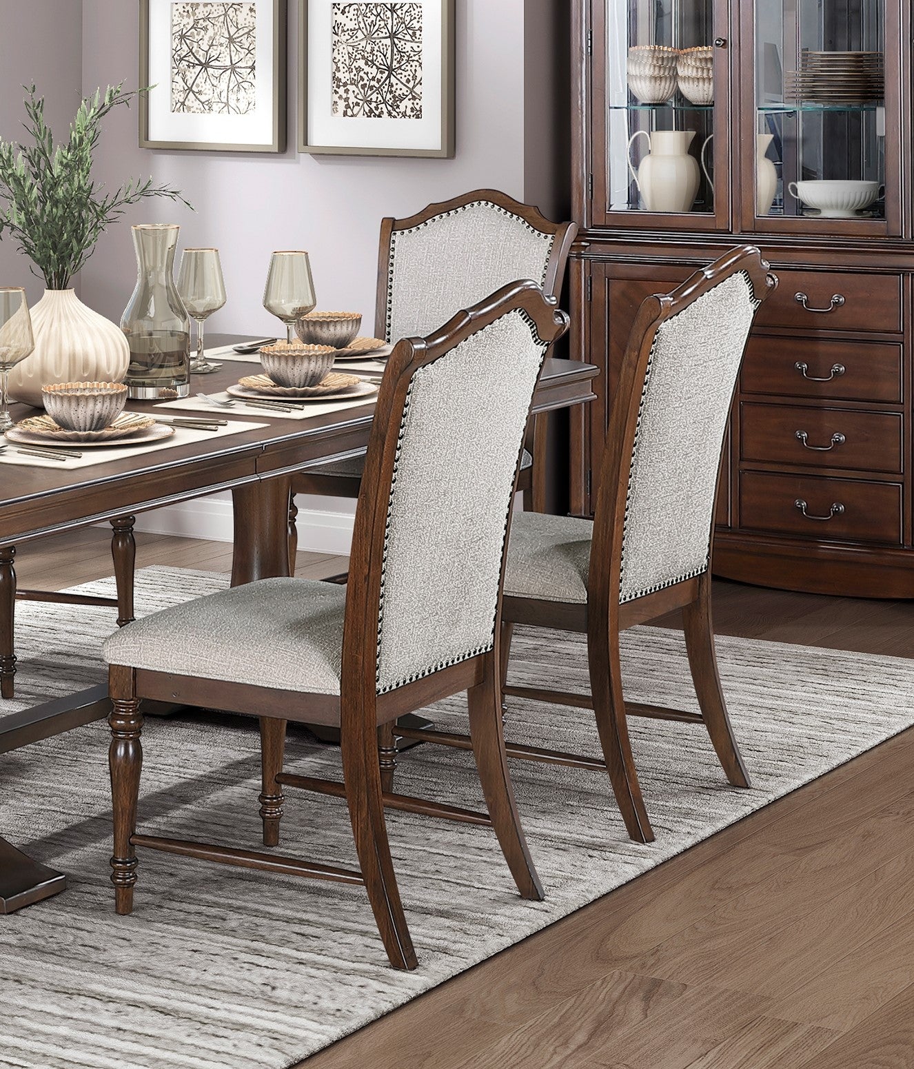 Tufted back dining chair with nailhead trim in light gray fabric and dark wood frame