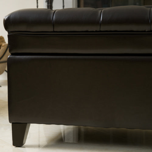 Dark brown tufted leather storage ottoman with sleek wooden legs